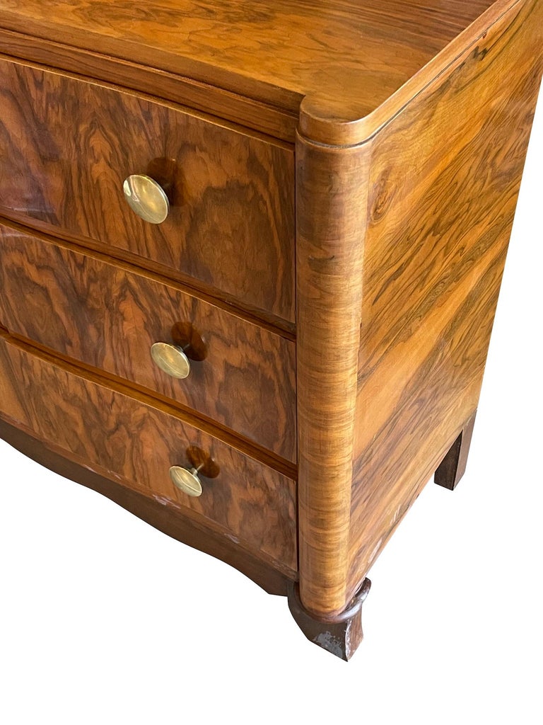 Mid Century French three drawer commode.
Polished palissandre wood with decorative grain details.
Original large brass knobs.
Arriving November.