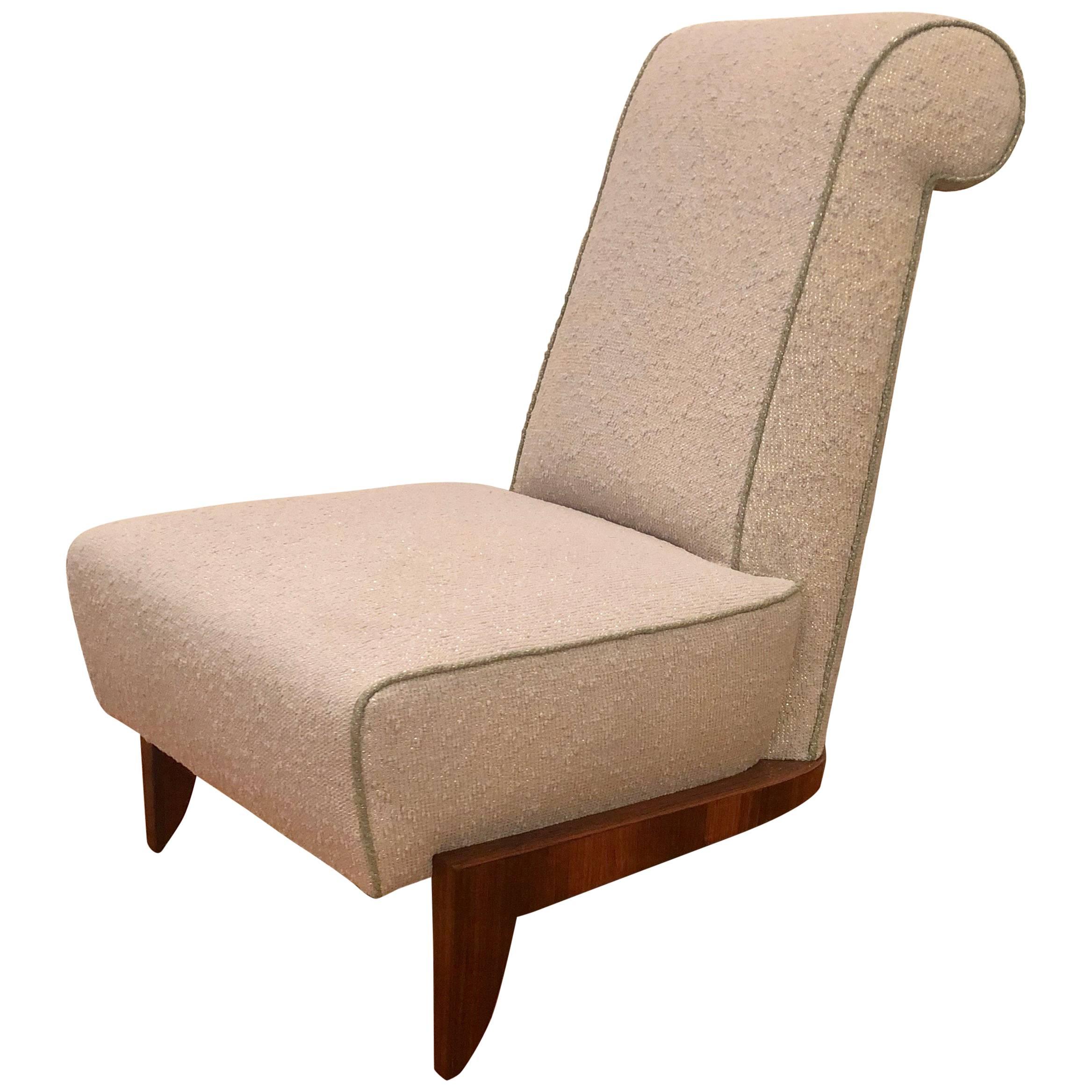 Elegant slipper chair by Dominique with a three-legged varnished palissandre base, an angled back, spring seat, and reupholstered in an excellently preserved 1950s nubby, woven fabric with golden metallic detail, and welting in the same fabric in