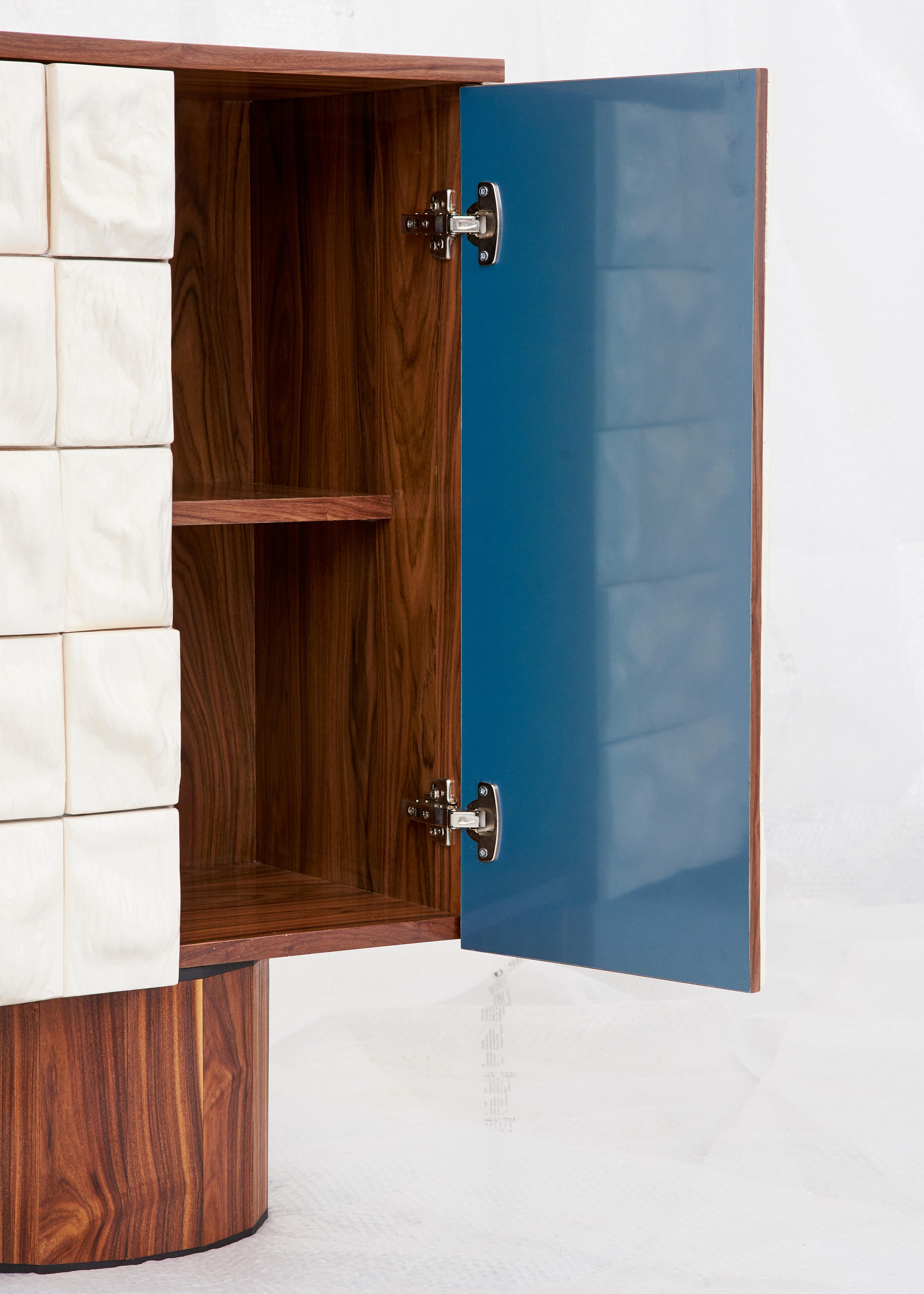 Palissandro cabinet is presented by CAMP

Rem Atelier cabinet is the perfect combination of the linear palissandro wood structure and the organic clay tiles that enrich the doors surfaces.