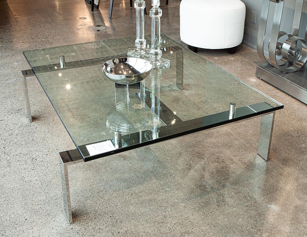 Pall Mall cocktail table by Ralph Lauren. A designer coffee table that will promote your living room to an all new level of class, while remaining almost invisible in all its lightness! With a stainless-steel base, steel cylinders and a floating