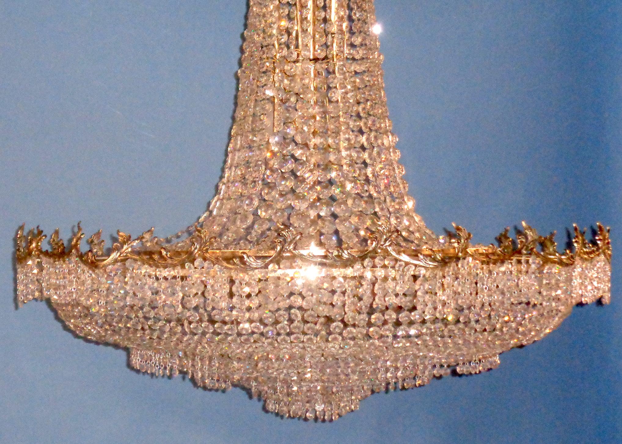 Silver plated Palladian chandelier adorned with swagger multifaceted crystals. It was custom made for Perino’s, known as the premier restaurant for famous celebrities. This chandelier hung in their private dining room. There are twenty three tiered