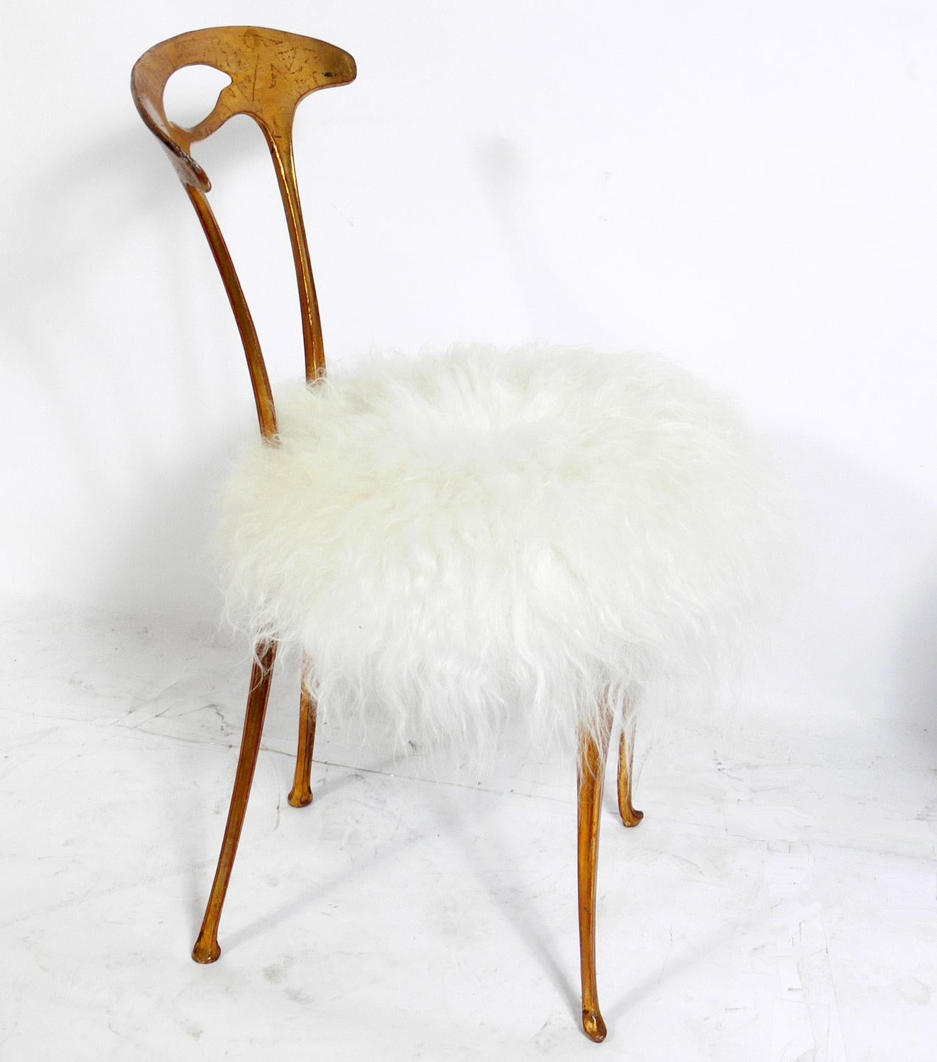 Gilt metal chair and table, designed for Palladio, Italy, circa 1950s. 
The chair has been reupholstered in a faux fur. It measures 32
