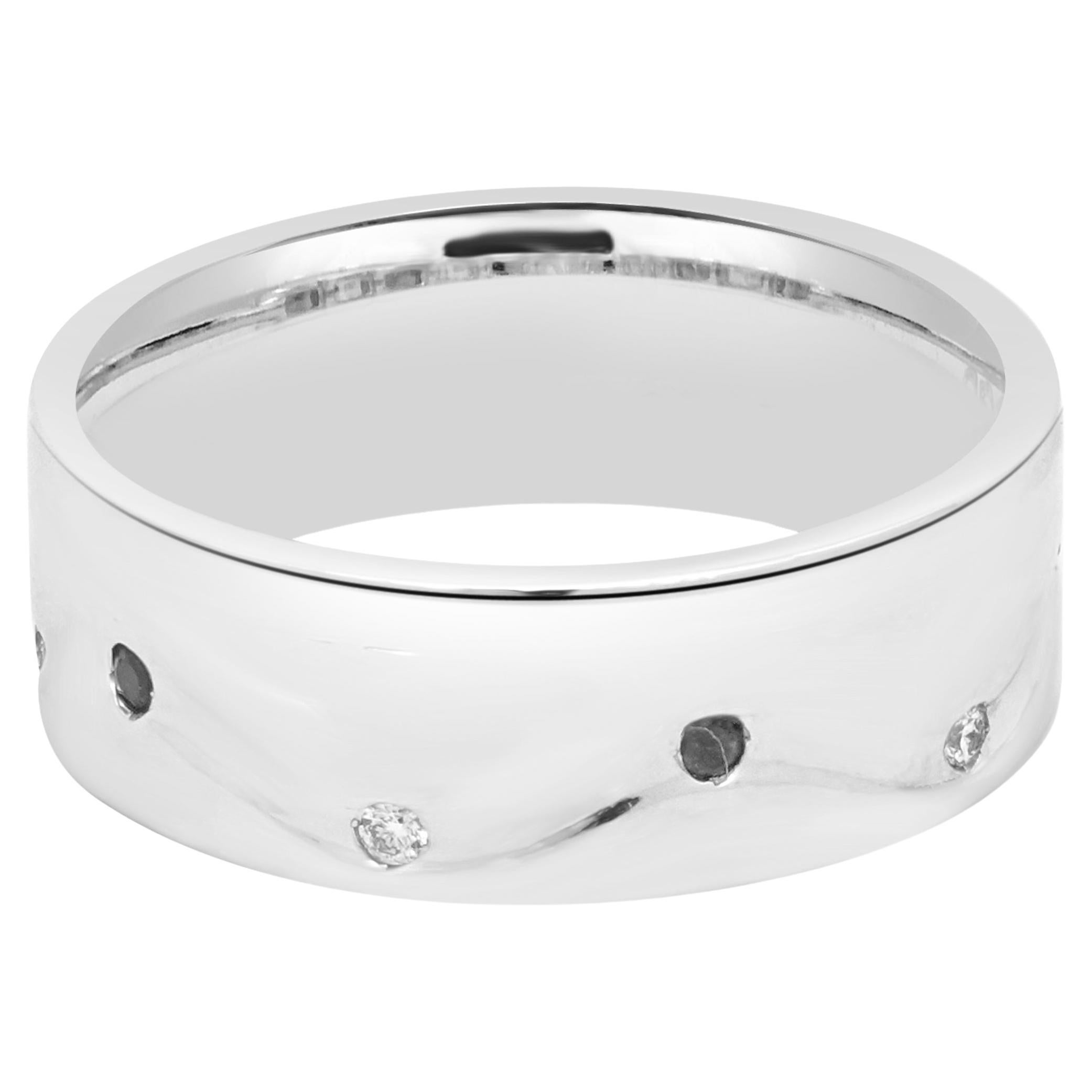 Designer: custom
Material: palladium
Diamond: 5 round cut = 0.08cttw
Color: G
Clarity: SI1
Ruby: 5 round cut = 0.10cttw
Dimensions: ring top measures 8mm wide
Size: 11
Weight: 10.78 grams
