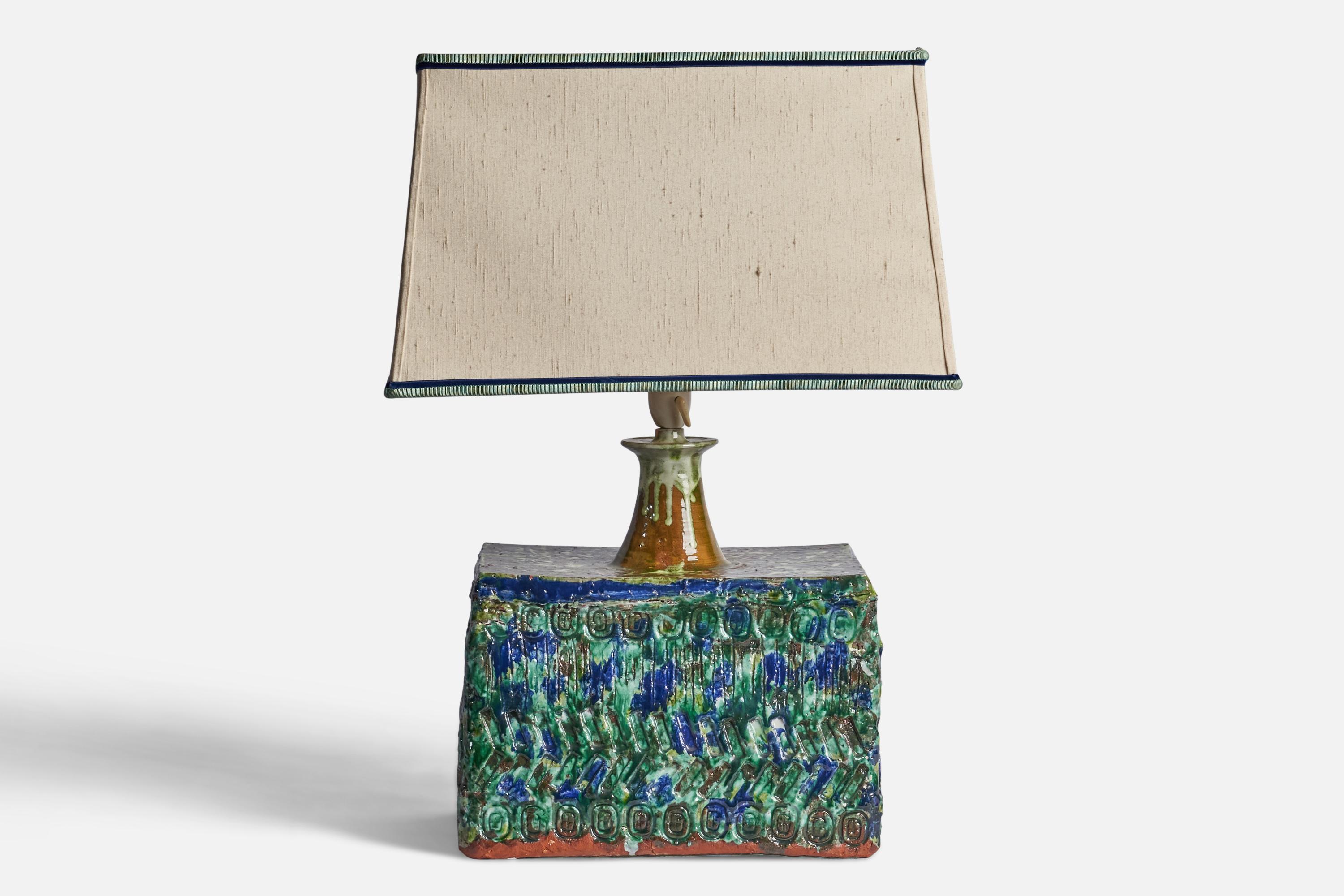 
A sizeable green and blue-glazed stoneware and fabric table lamp designed and produced by Palle Jensen, Denmark, c. 1960s.
Overall Dimensions (inches): 22.75 H x 12.75