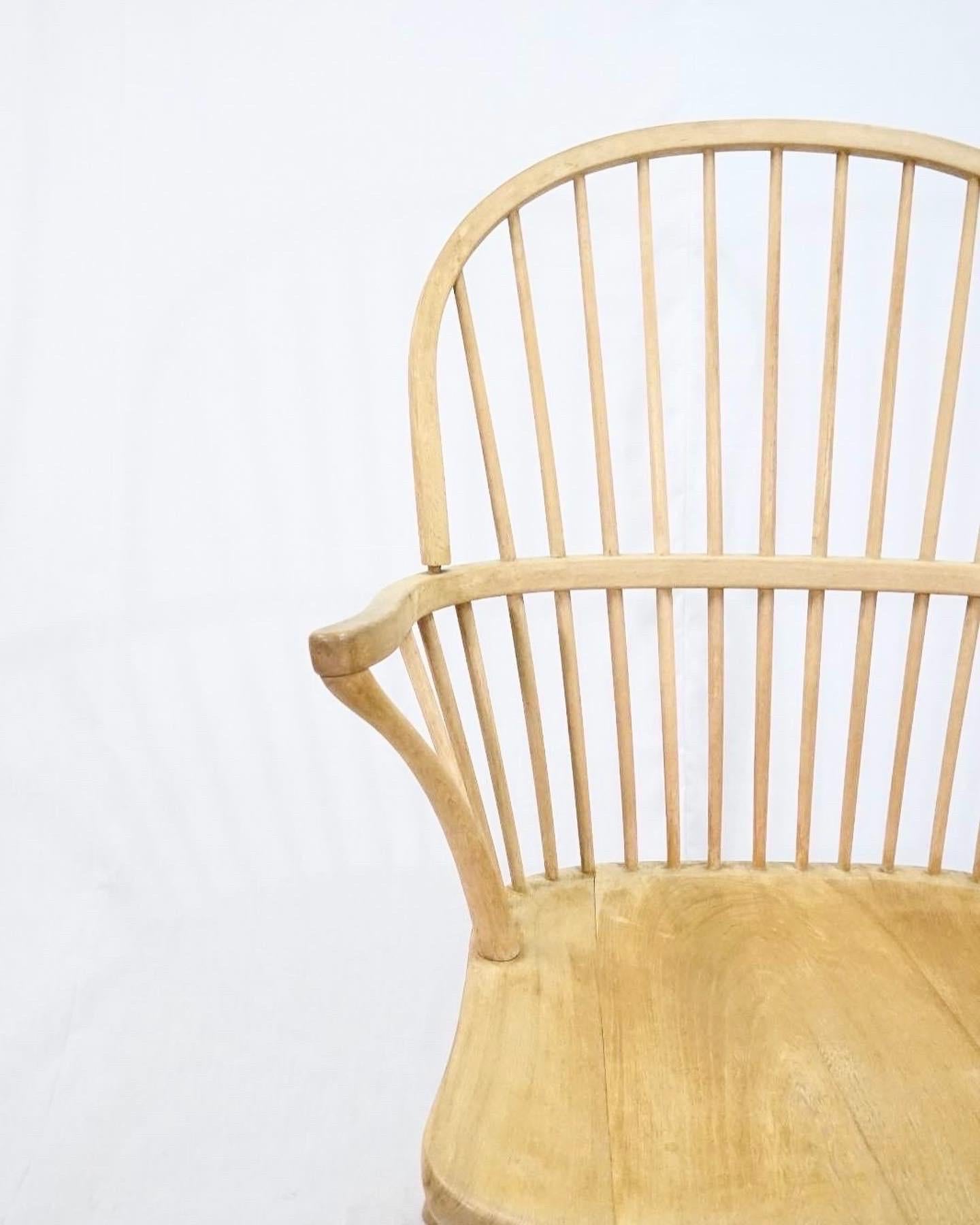 Rare Palle Suenson windsor chair in solid beech wood produced by Fritz Hansen in the 1940’s. 
The chair is made in solid beech wood and includes a seat and backrest cushion with a wool fabric upholstery that has later been made by a professional