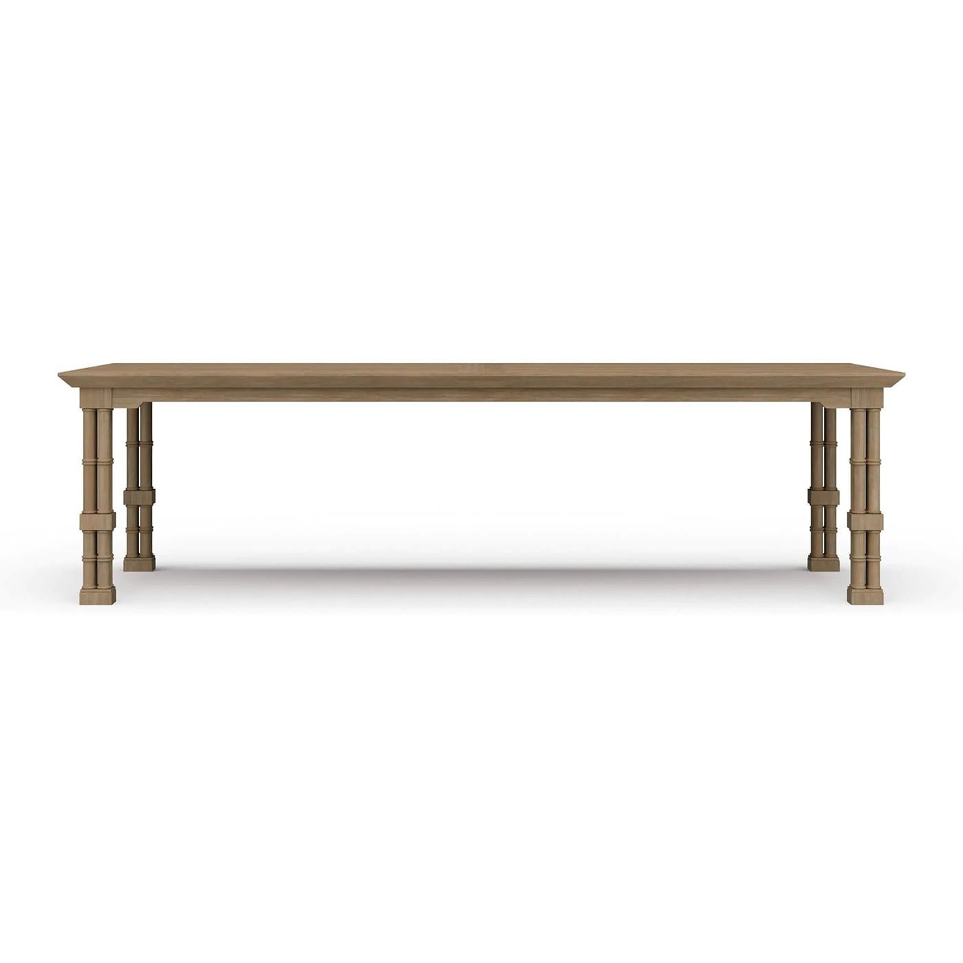 Hand-carved from mahogany and shown in our natural sandbar finish, this statement table features faux bamboo legs in the form of classic English cluster columns, joined by an X-form stretcher that adds both stability and architectural flair.

The