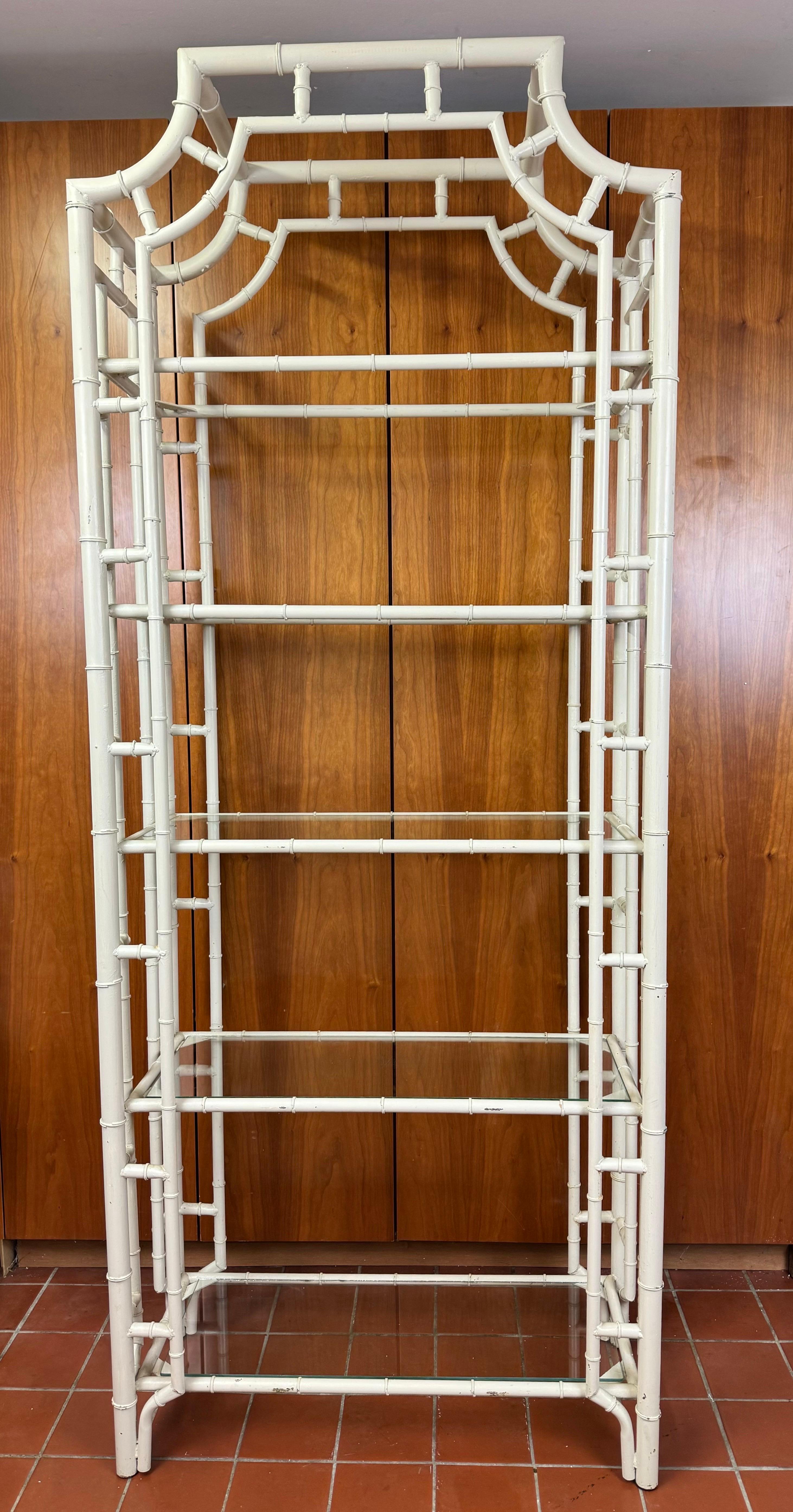 Palm Beach Regency Faux Bamboo Pagoda Etagere. Classic coastal design for that beachside home. Plenty of storage room in this beauty . It has 5 shelves total. Currently in an off white color. Use as is or respray with a high gloss if your