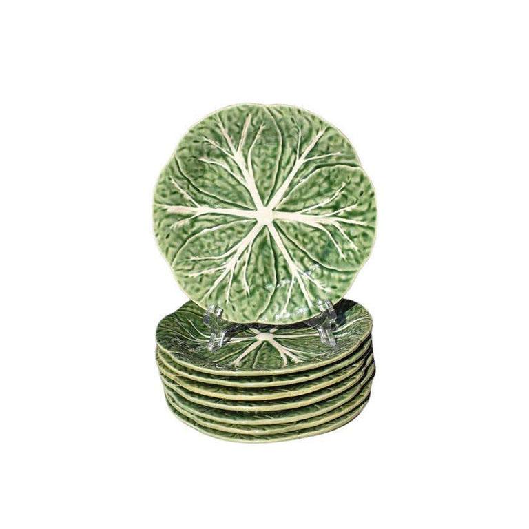 A large complete set of Portuguese cabbage ware or Lettuce ware tableware. This lovely green set will bring Palm Beach style to your next dinner party. By Raphael Bordallo Pinheiro and stamped at the bottom. 

Dimensions:
Small Salad Plates (8):