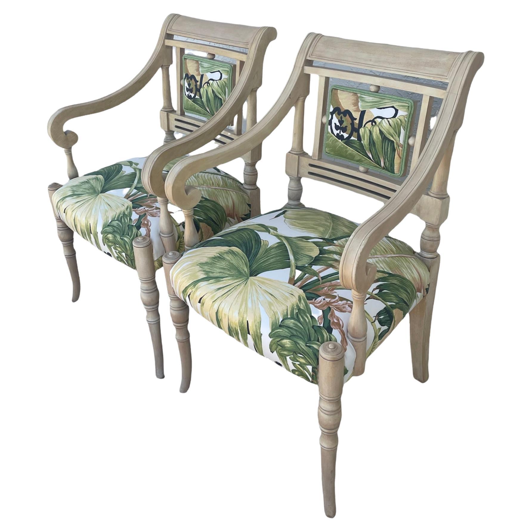 Ultra chic pair. Newly upolstered armchairs in a vintage graphic tropical print by Boussac Tissu D' ameublement. Swedish design, plaid, circular legs, painted with a fabric back window cut-out, detailed design in the woodwork makes these a very