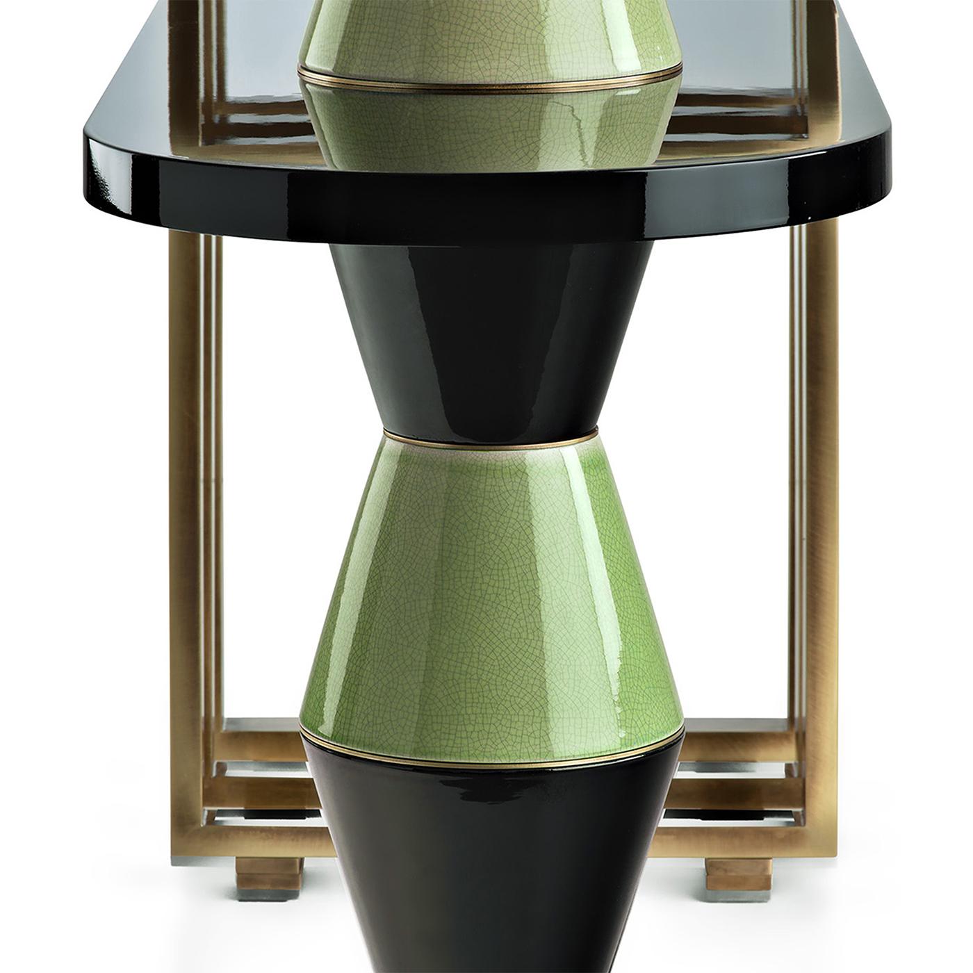 A marvelous furniture piece distinguished sculptural design, this console blends classic materials and modern furniture elements with a colorblock glazed column fashioned of piled ceramic cones. The rigorous structure in brushed-finished brass