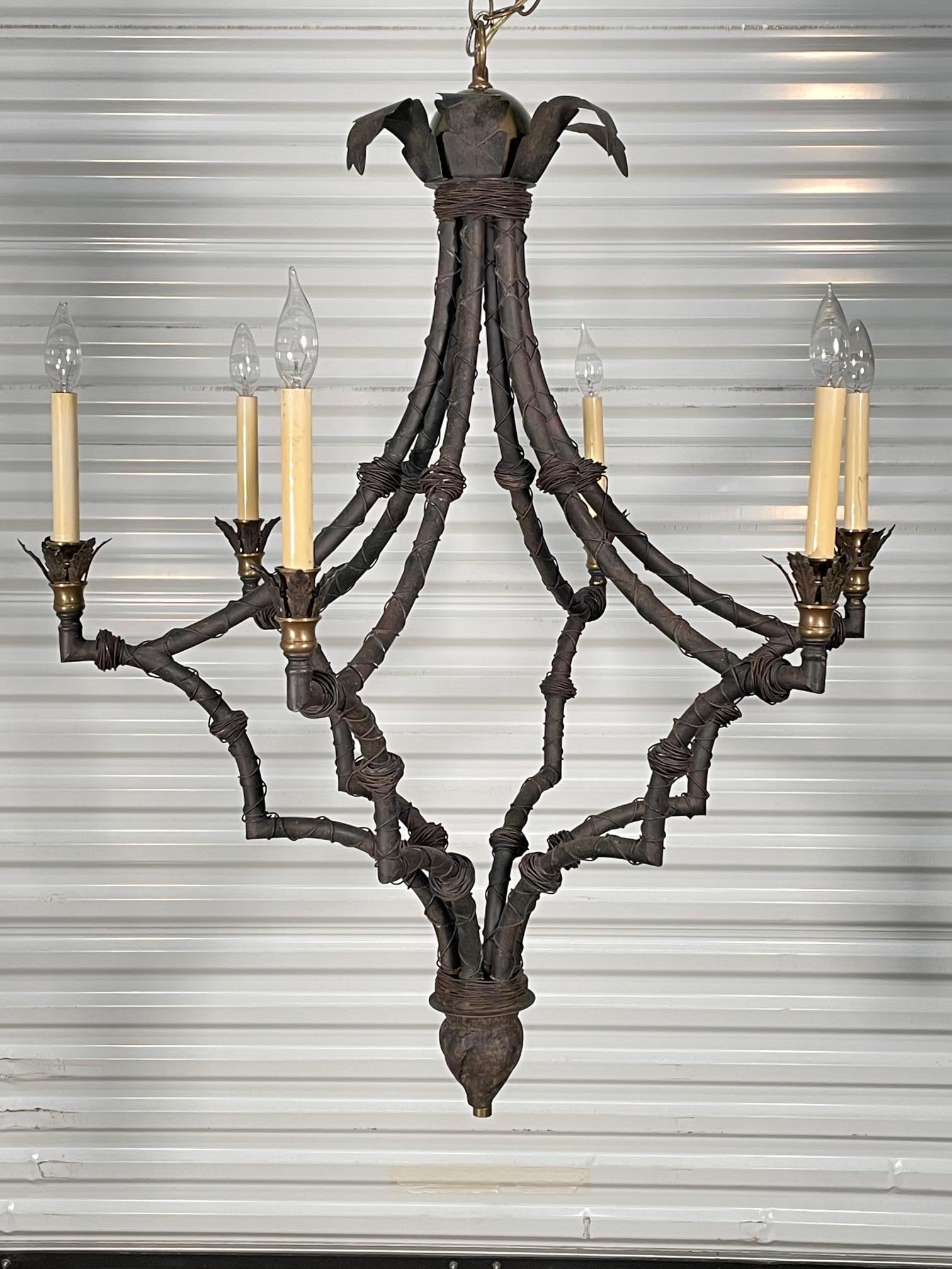 Large 6-light iron chandelier features palm frond details along with a wire wrapped frame in a modern faux bamboo motif. Good condition with imperfections consistent with age (see photos).
 
 