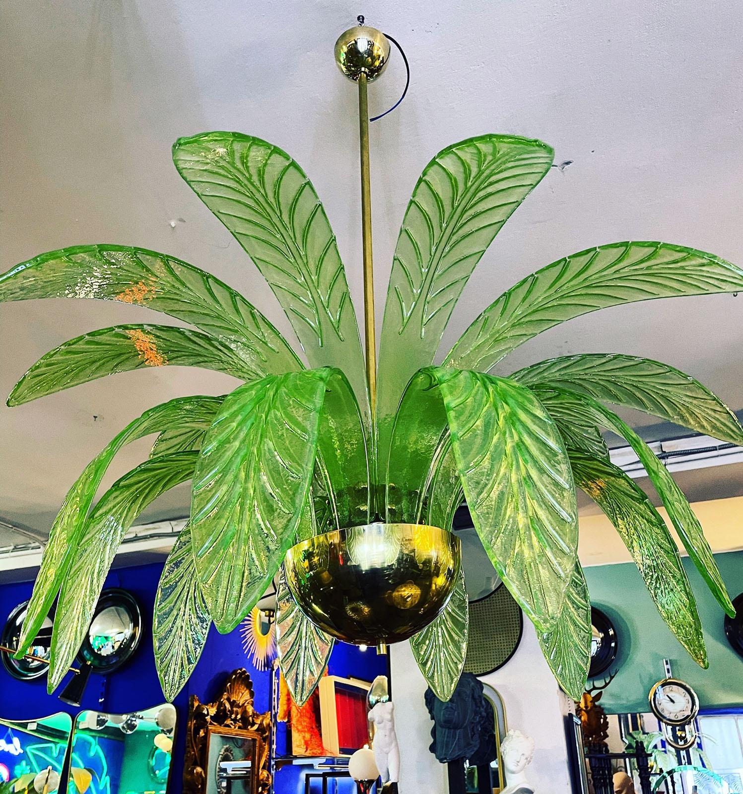 Mouth-blown Murano glass chandelier, brass structure, 20 Murano glass leaves, disposed in the shape of a palm tree crown.
Equipped with 3 light bulbs (E14 for Europe, E12 on request for the USA)
Diameter 100cm, height 110cm.
Available in Pearl