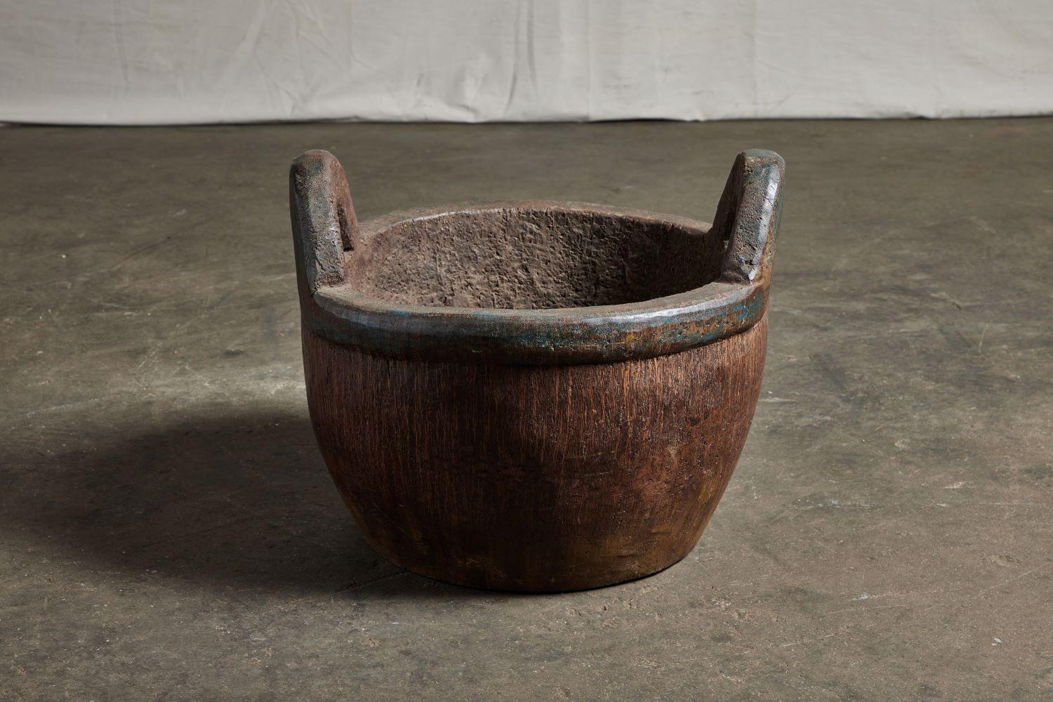 Wooden Palm pot with handles.