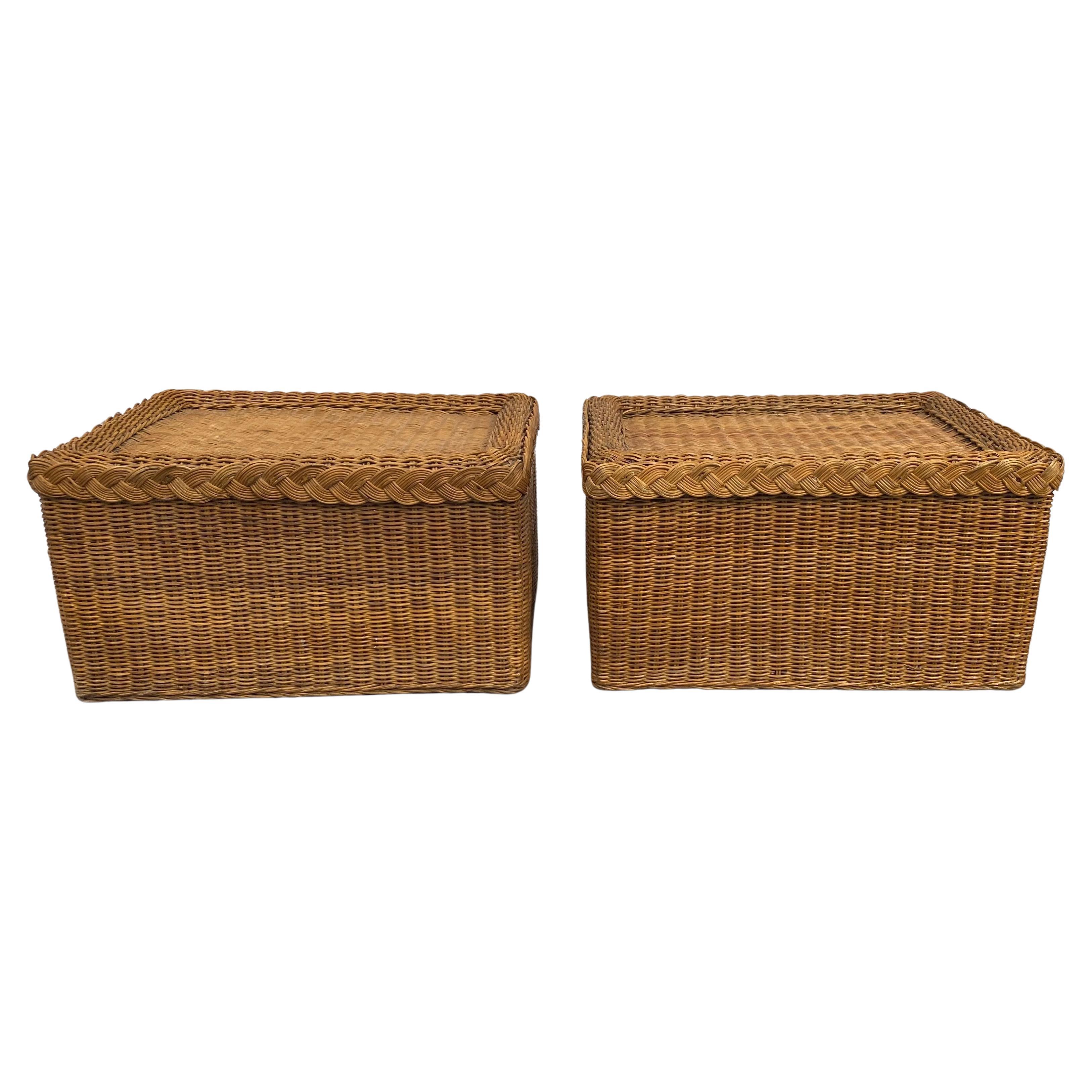 Fabulous pair of Palm Regency Style hand-woven wicker ottomans with braided trim detail.  These beautifully aged patinaed stools feature warm honey tones of varied light and dark shades.  These coastal chic rectangular benches are perfect for extra