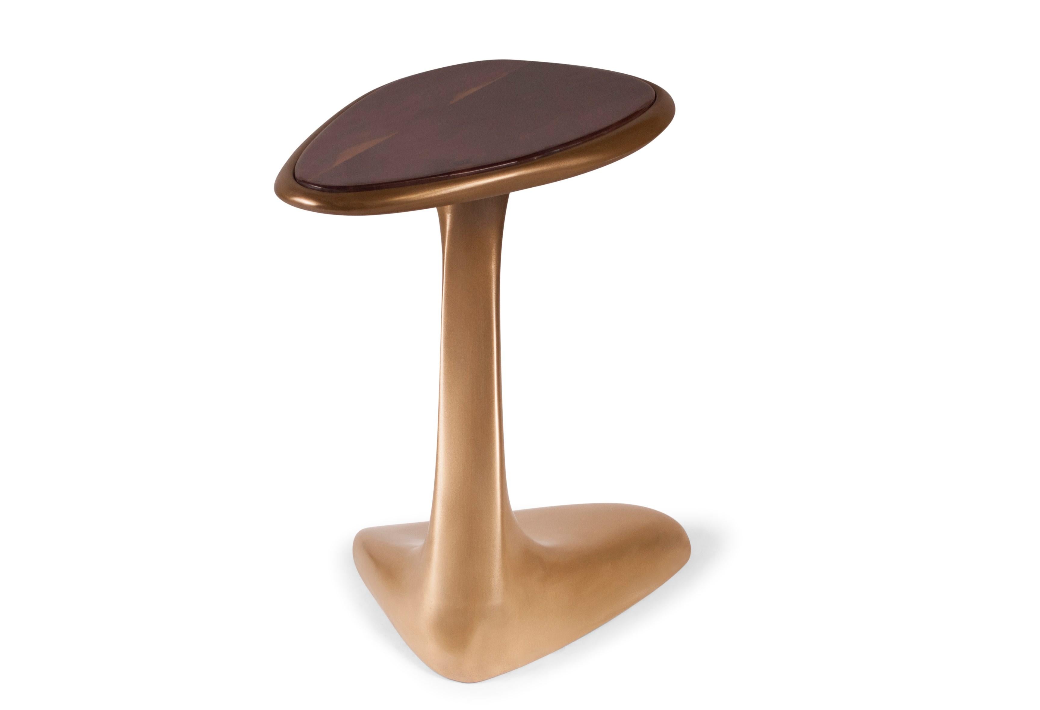 The palm side table is made out of wood with our custom gold finish with high polished walnut top.

About Amorph: 
Amorph is a design and manufacturing company based in Los Angeles, California. We take pride in hand crafted designs connected to