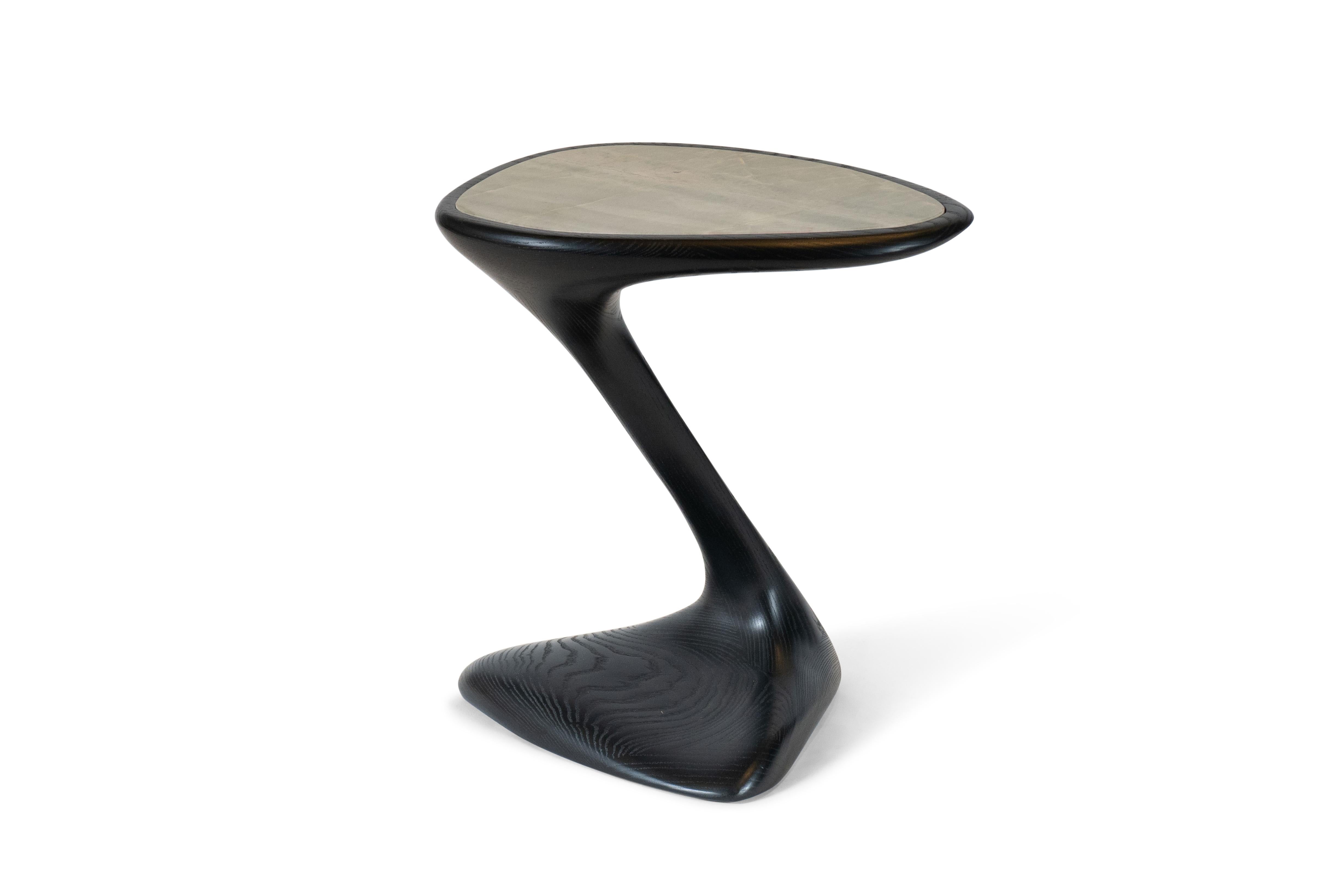 The palm side table is made out of wood with bronze finish with black marble top.

About Amorph: 
Amorph is a design and manufacturing company based in Los Angeles, California. We take pride in hand crafted designs connected to technology to create