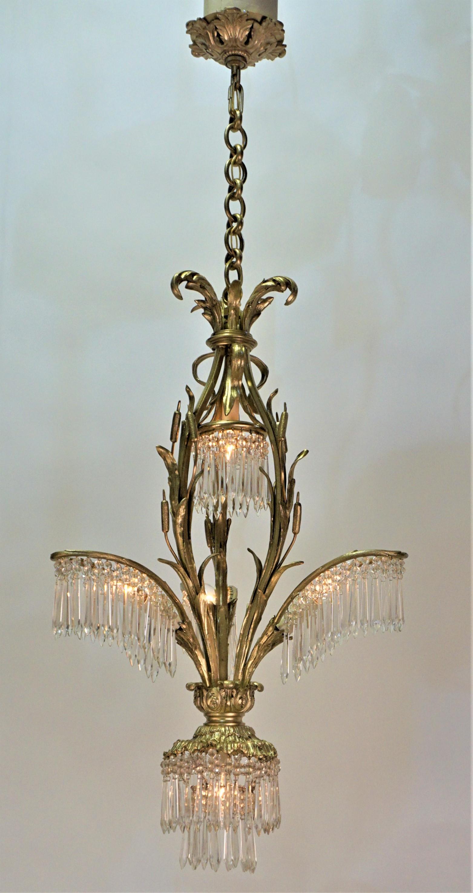 Elegant design palm tree five light bronze and crystal chandelier.
17