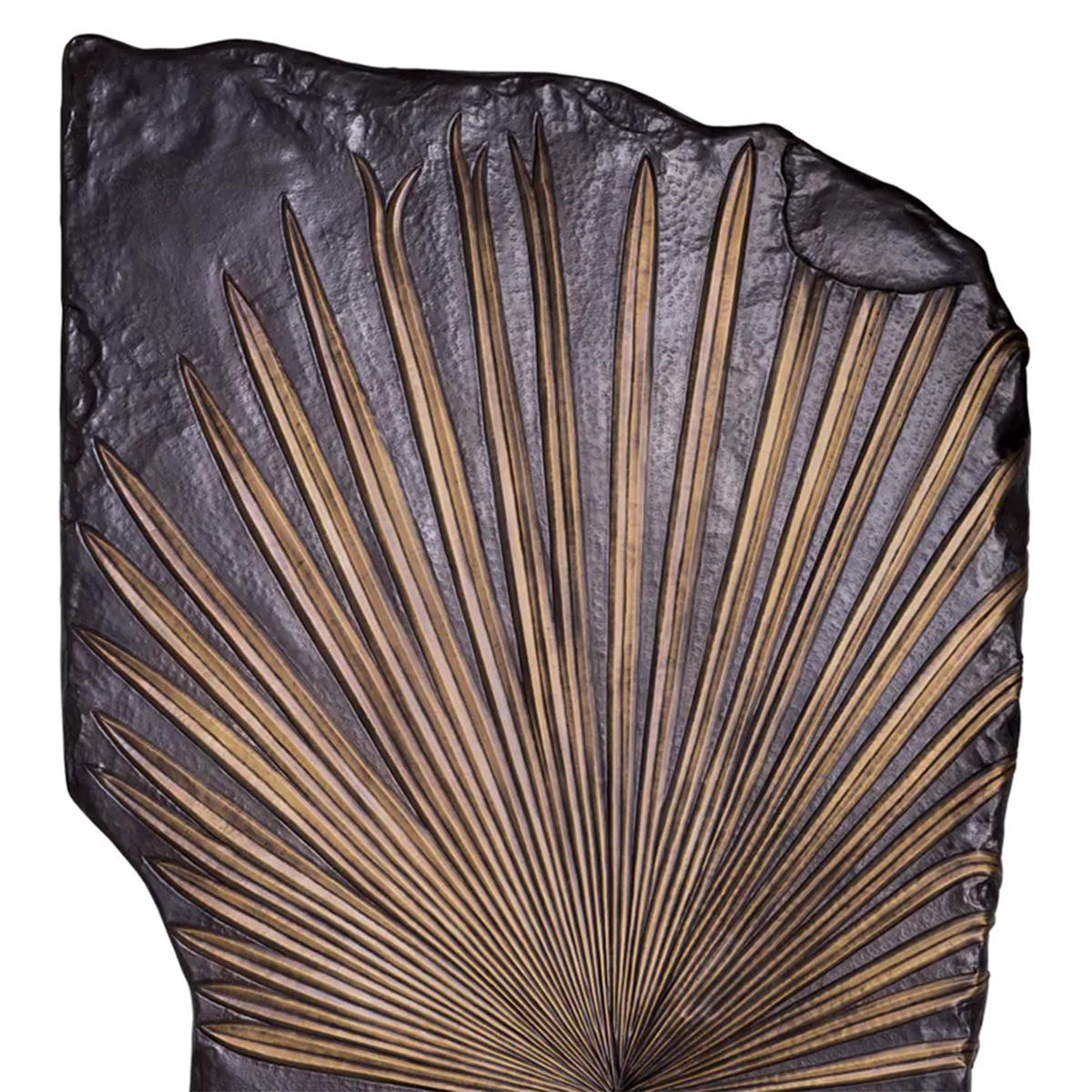 Wall Decoration Palm Tree Leaf with iron structure
in bronze finish and with carved palm leaf in brass
in antique finish.