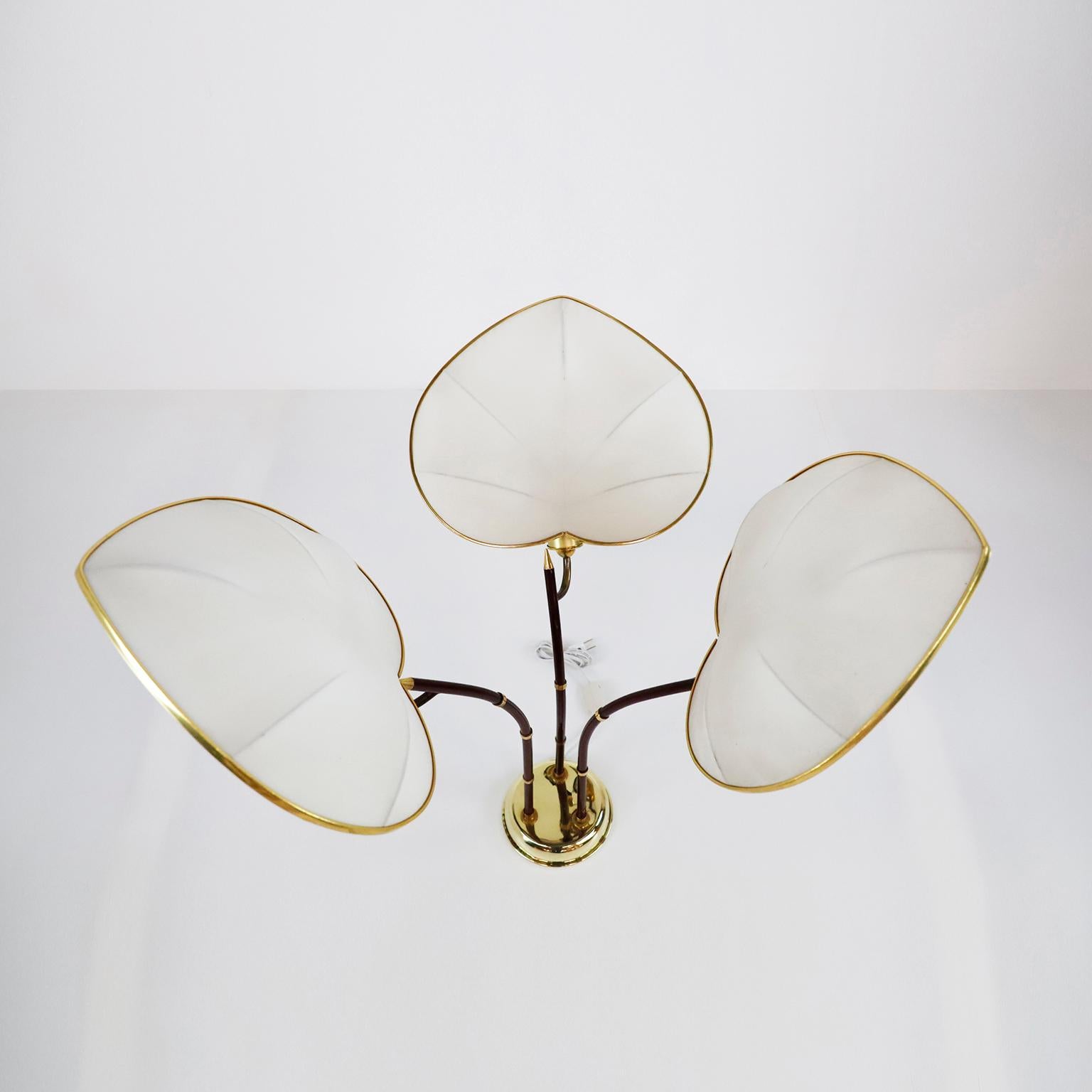 Circa 1960, We offer this Palm Tree Table Lamp designed by Arturo Pani. This lamp is perhaps one of the most whimsical of all the wonderful designs by Arturo Pani. Crafted of brass and tubular metal lacquered in a wine color, the angle of the stems