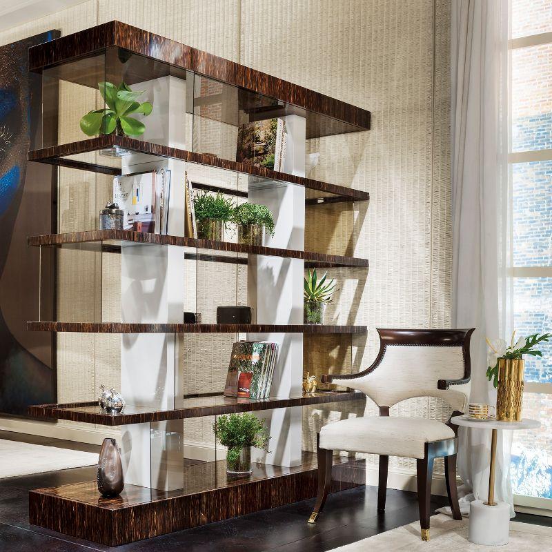A visually striking, asymmetrical design of iconic character describes this splendid bookcase, fashioned of precious palm wood and enriched with smokey glass sliding panels. The structure is fashioned of lacquered wood.
