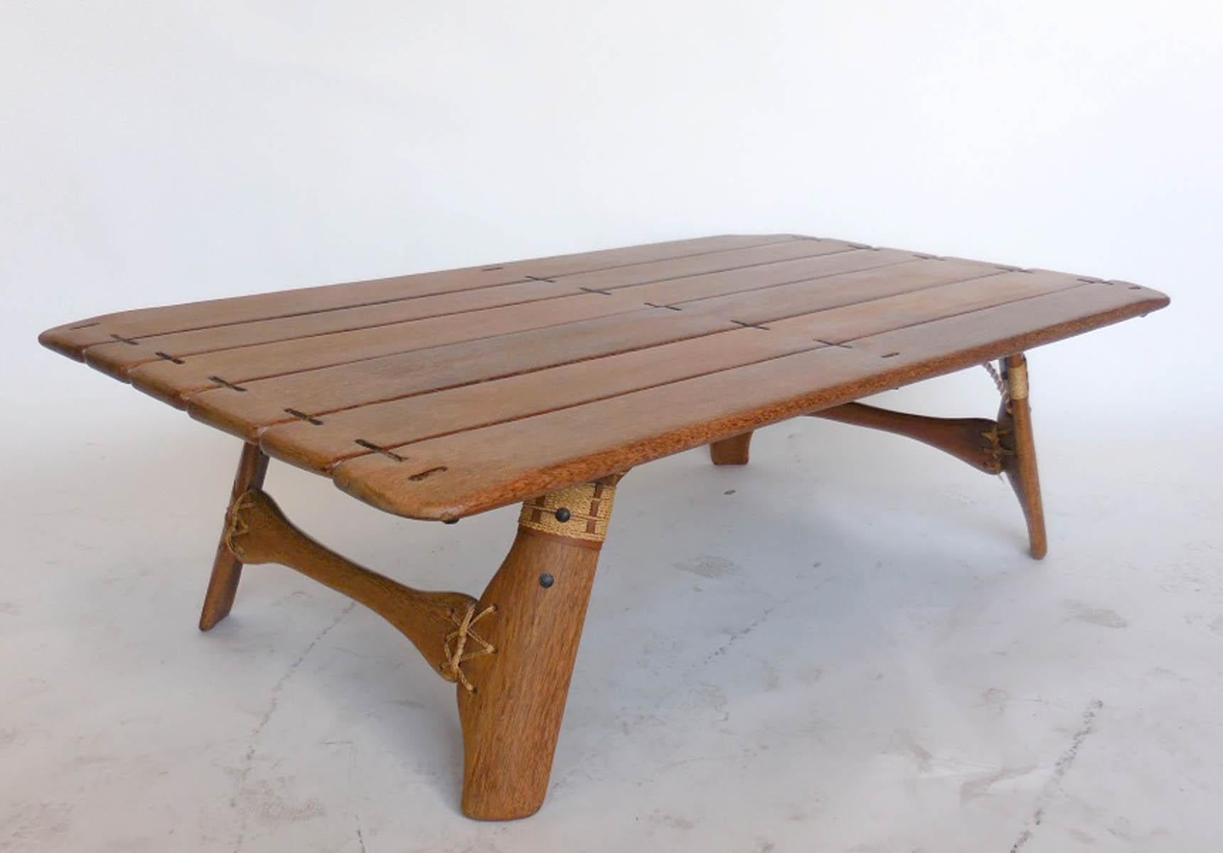 This coffee table made in Australia, in the 1990s. Constructed of palm wood and leather and rope. In very good condition. Beautiful variegated colors throughout sustainable tropical palm wood. Great patina! Interesting construction and side view is