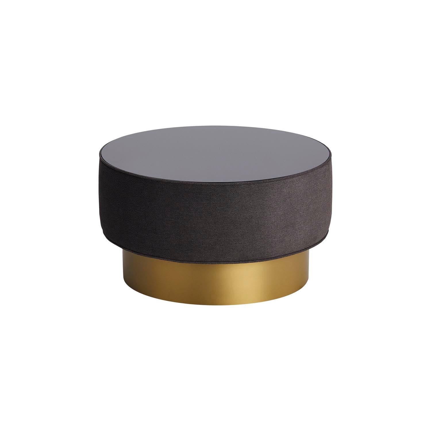 Palma II is a round coffee table with a modern and refined style, covered entirely in fabric, with a colored glass top that gives it a contemporary look.‎ Palma is available with Antique Brass lacquer base.

Shown with structure covered in Tiffany