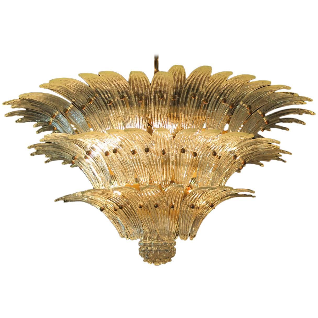 Palmette ceiling light made by Murano trasparent glasses in a gold metal frame. Murano blown glass in a traditional way. Structure in gold colored metal.
Period: 1980s
Dimensions: (85 cm) - height (115 cm) diameter;
Dimension glasses: 10.25 inches