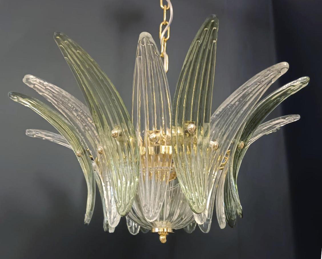 Italian Palmette chandelier shown in clear and green Murano glass leaves, mounted on 24k gold plated metal finish frame / Made in Italy
4 lights / E12 or E14 type / max 40W each
Measures: Diameter: 20.5 inches / Height: 10.5 inches
Order Only / This