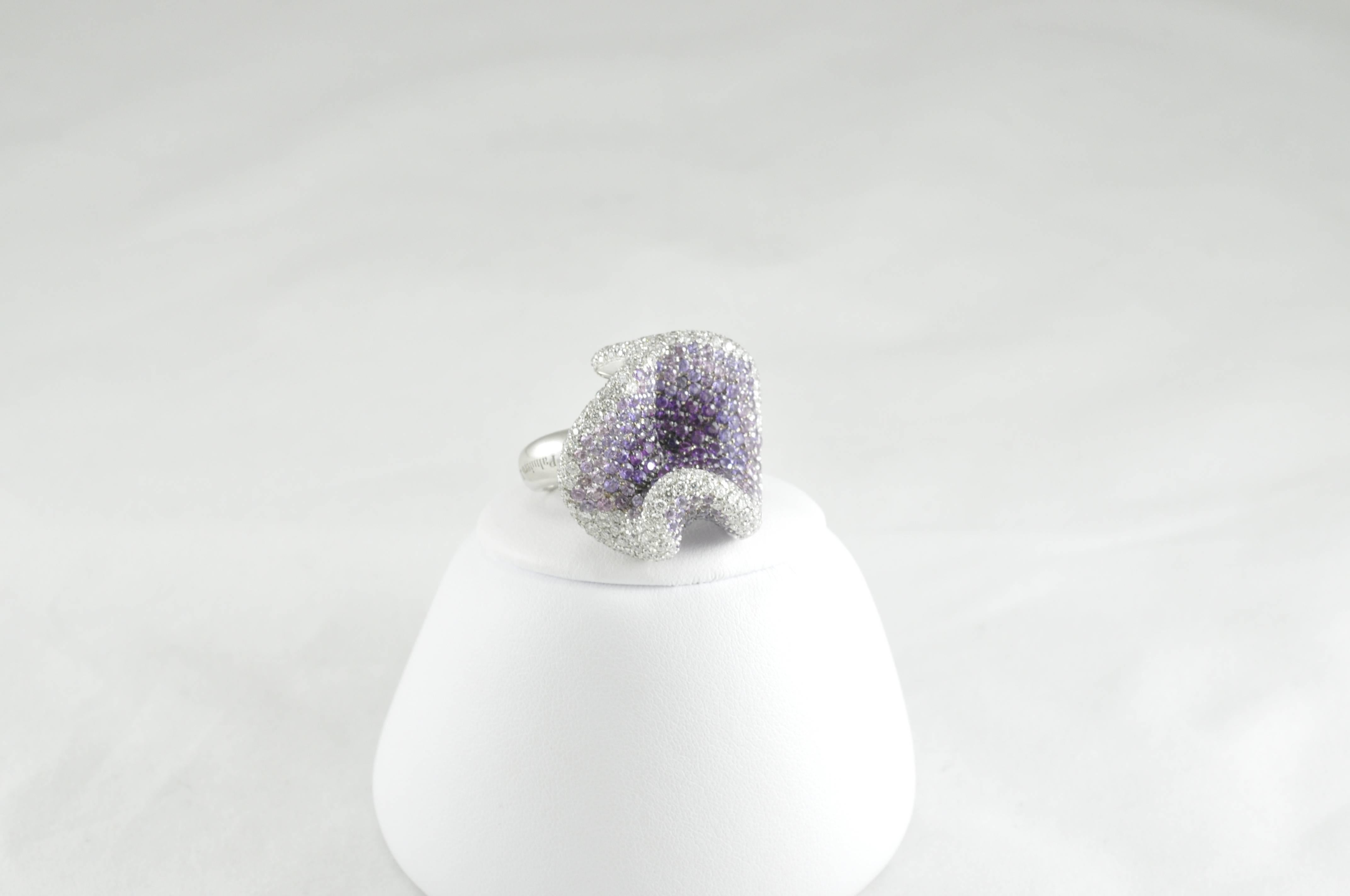 Palmiero Flower Ring 18K White Gold with Pink and Purple Sapphires and White Diamonds. The ring contains 224 Round Brilliant Diamonds at approximately 4.5ctw and 171 Pink and Purple Sapphires totaling roughly 5.00ctw. 
The ring is stamped 750 JD,
