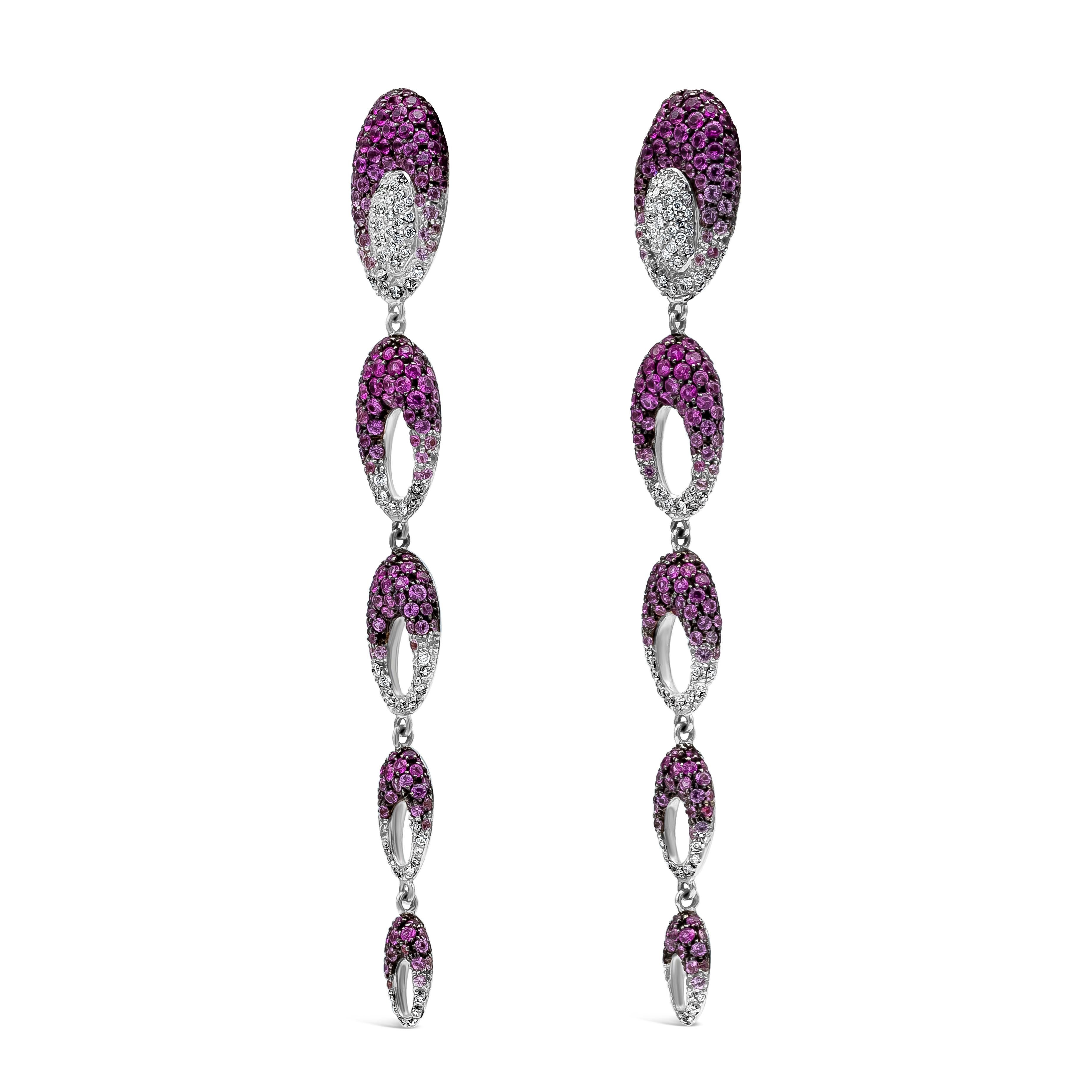 An exquisite and elegant fashion drop earrings featuring purplish-pink sapphire weighing 8.83 carats total, and round white diamonds weighing 4.01 carats, F Color and VS in Clarity. Showcasing five circle open work, in a beautiful ombre from