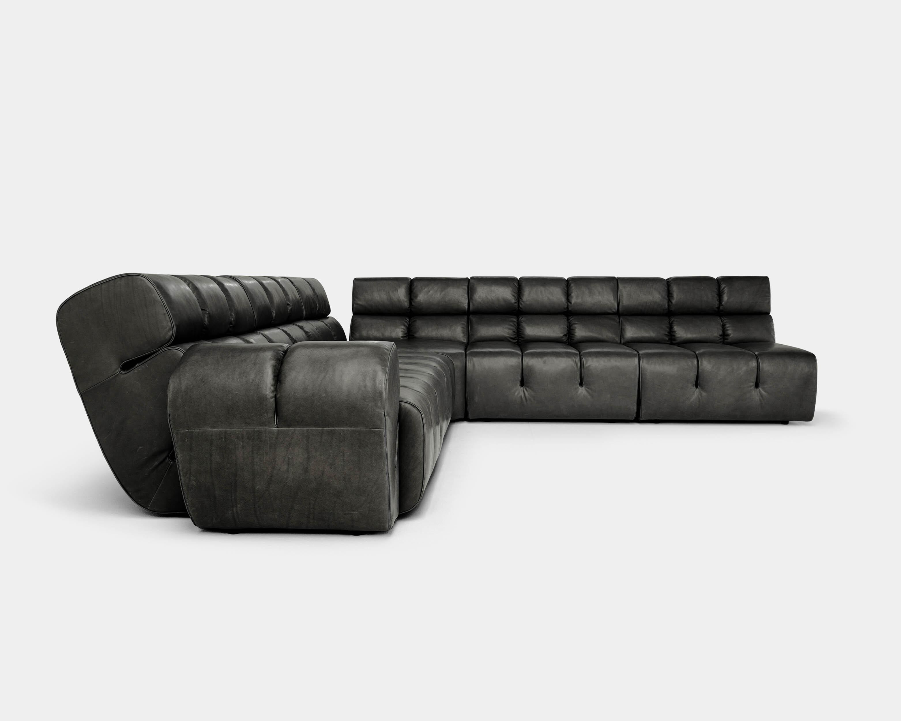 Sectional sofa Palmo by Amura Lab 
Designer: Emanuel Gargano

Model shown: Leather - Stone Wash 263 

Inspired by the natural gesture of an opening hand, Palmo is the new living concept designed by Emanuel Gargano.
The leather folds become the