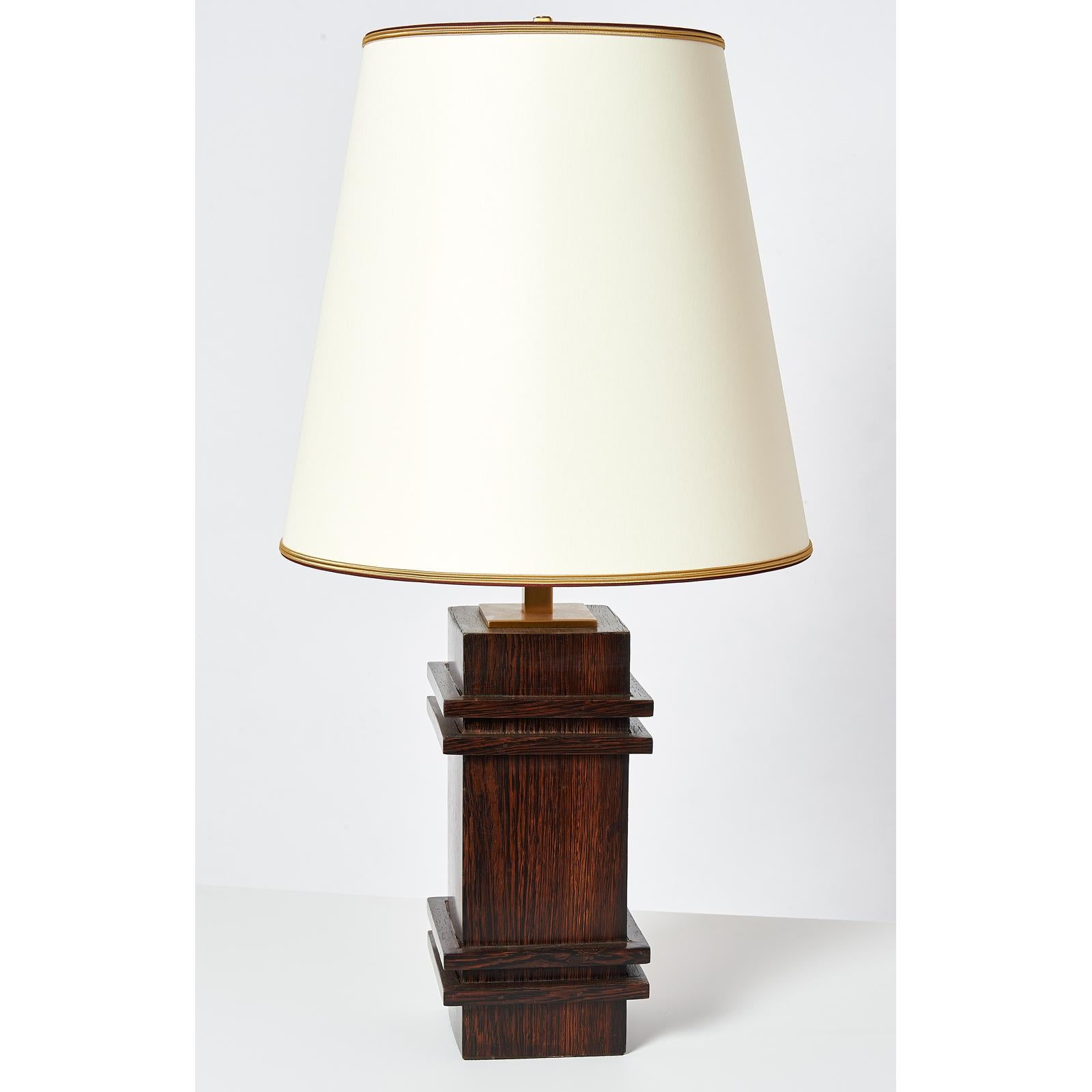 France, 1950s
Sculptural palm wood table lamp, att. to Jacques Adnet
Dimensions: 32 H x 16 Ø
Rewired for use in the USA with two standard base bulbs.
Ref: Alain-Rene Hardy  Jacques Adnet book  p.243 
Available with round or square shade