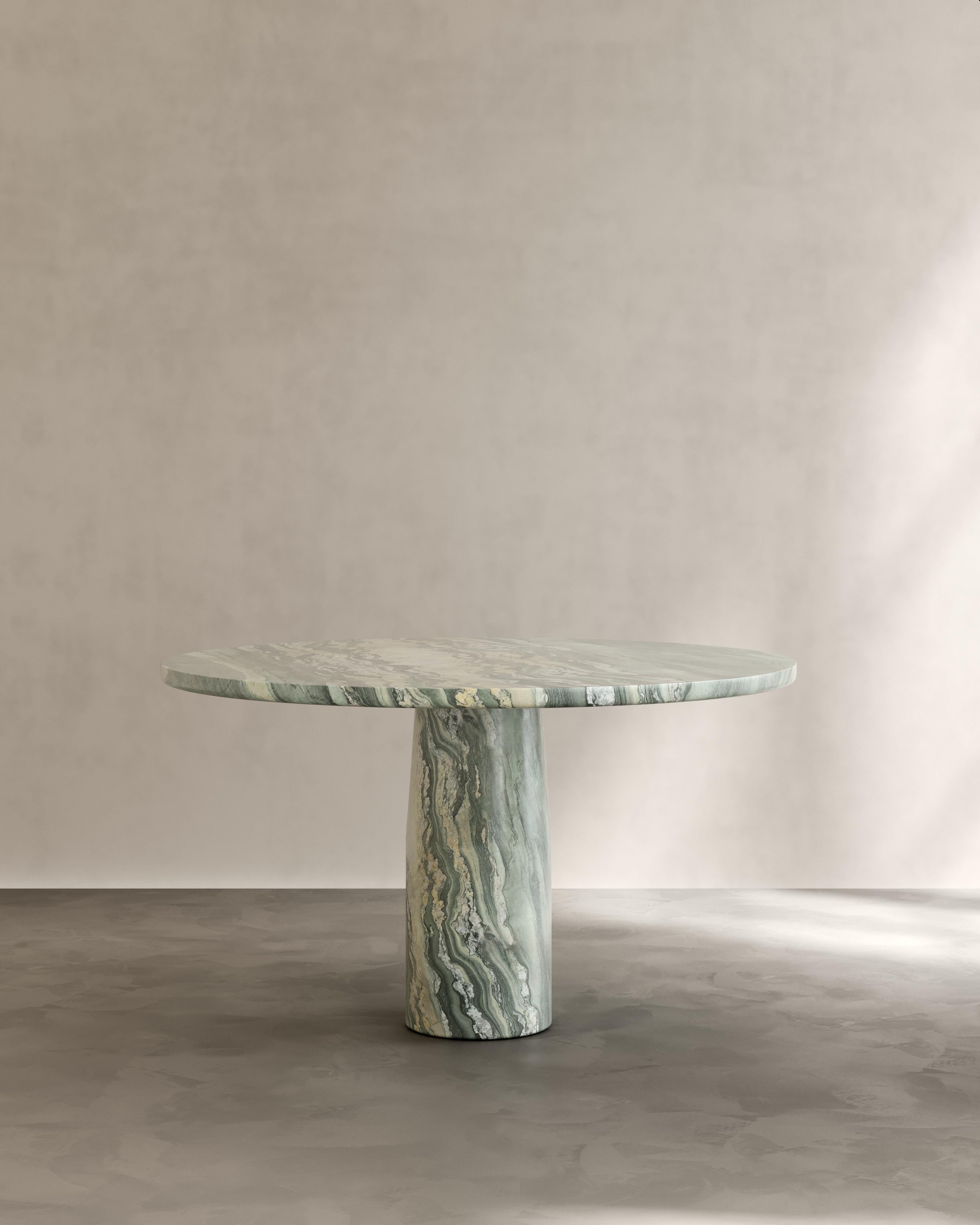 The Isola Dining Table by Paloma Editions is handmade in Italy. Sculpted from solid Italian natural stone. Our workshop on site the quarries near Rome and Carrara draw on generations of master stone masons who transform these materials into enduring