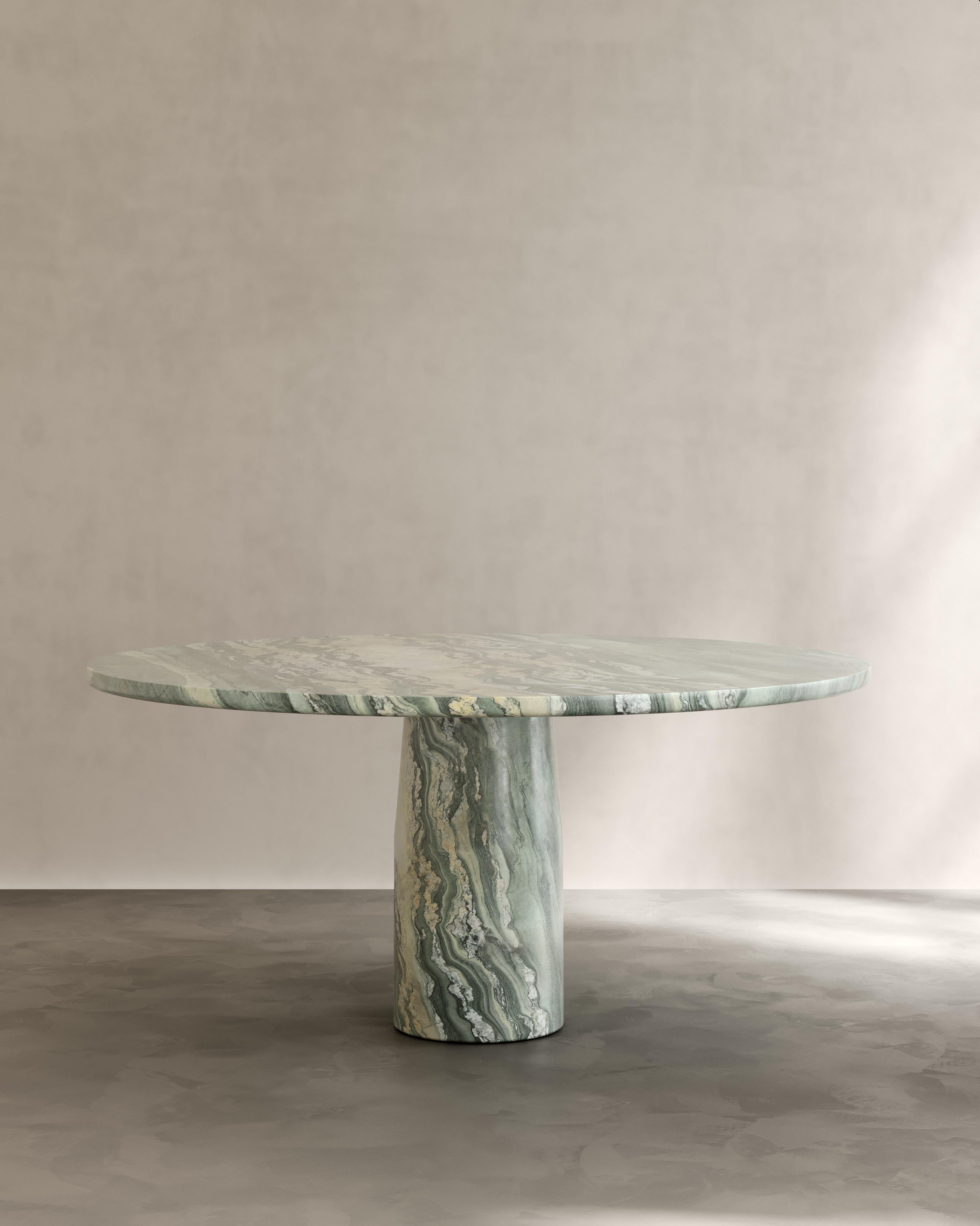 The Isola Dining Table by Paloma Editions is handmade in Italy. Sculpted from solid Italian natural stone. Our workshop on site the quarries near Rome and Carrara draw on generations of master stone masons who transform these materials into enduring
