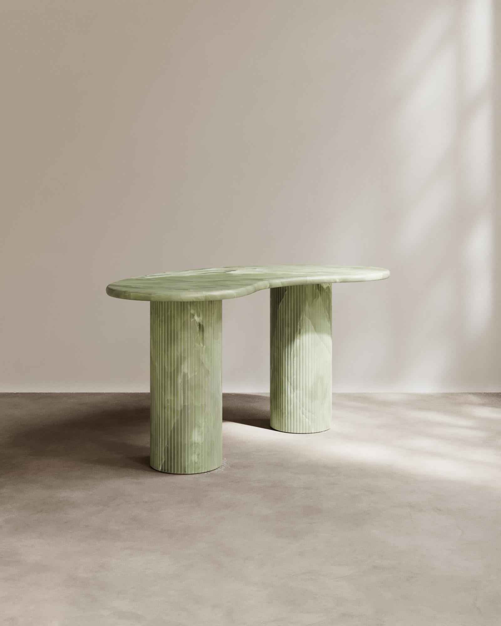 The Theory Desk by Paloma Editions showcases our signature directional line work and a classic kidney bean shape. Theory Desk is conceived as an heirloom for the modern thinker—a place where contemplation and craft meet in perfect counterpoise.

The