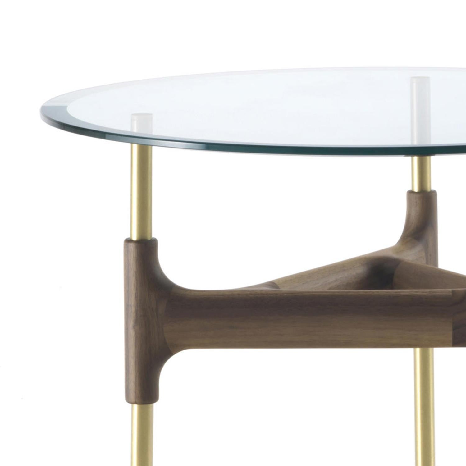 Side table paloma glass with hand-crafted
solid walnut base with steel feet in brass finish.
With bevelled tempered clear glass top, 12mm
thickness.