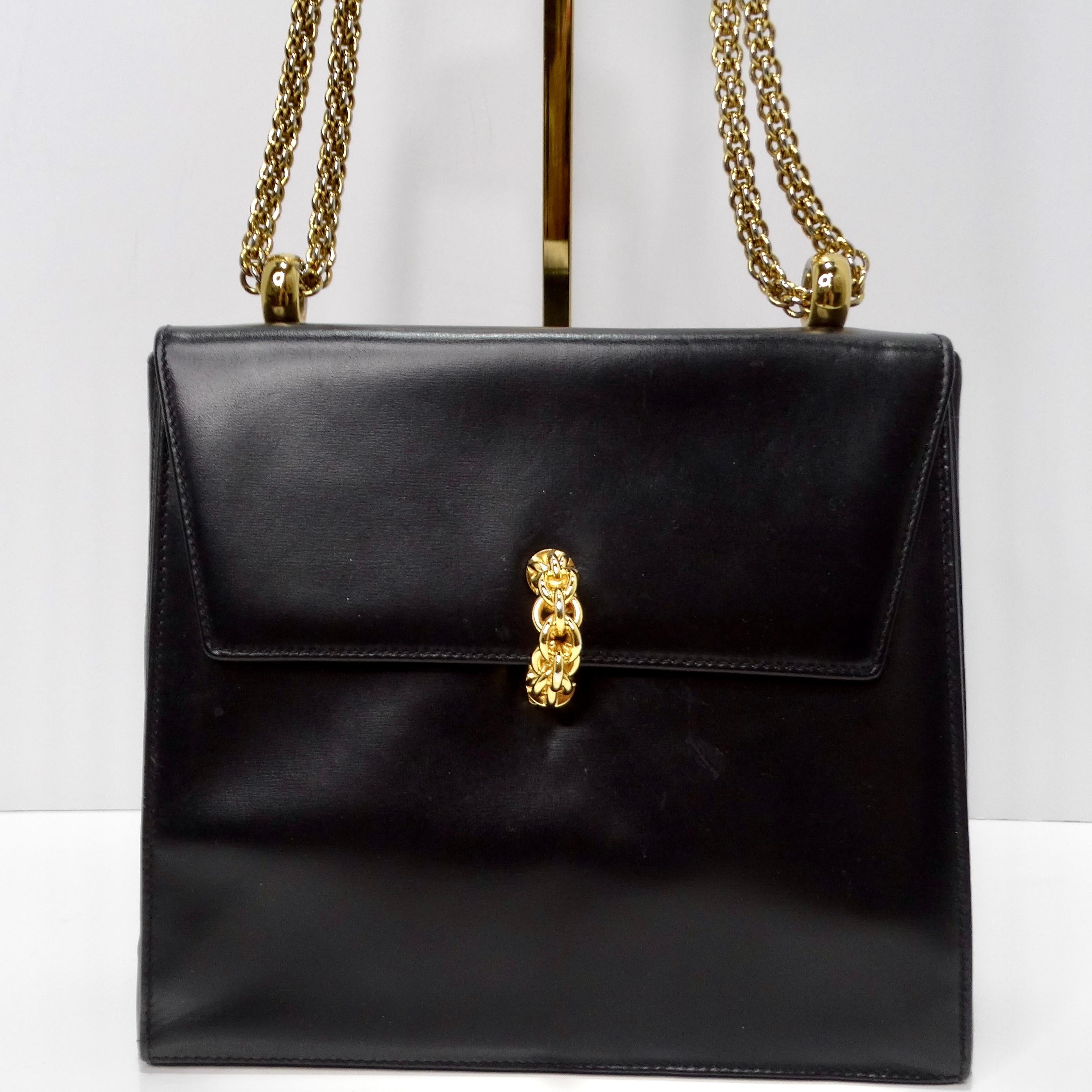The Paloma Picasso 1980s Black Leather Shoulder Bag is a stylish and sophisticated accessory that adds a touch of elegance to any ensemble. Crafted from black leather, this structured handbag features a timeless design with a modern twist.

The