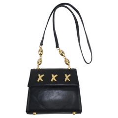 Sac à main Paloma Picasso en cuir noir avec logo en forme de X