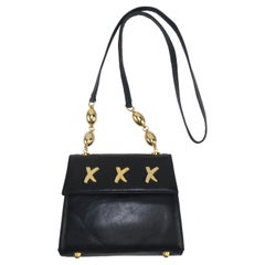 Paloma Picasso: Schwarze Lederhandtasche mit X-Logo