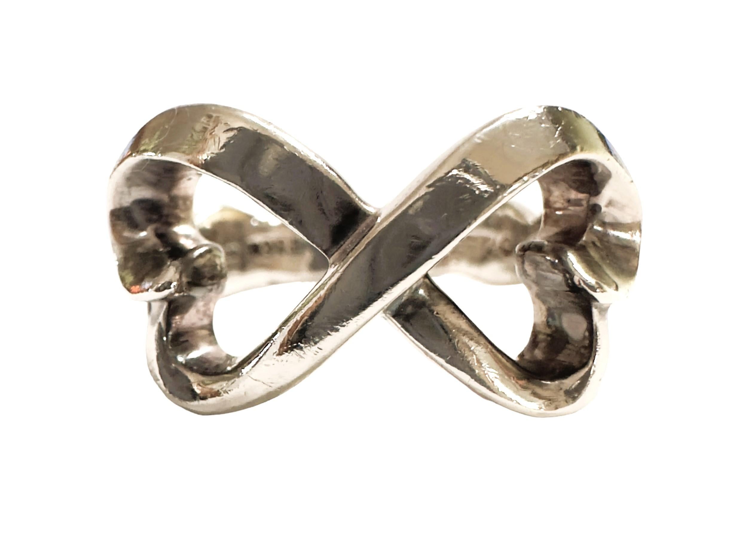 This is a very nice pre-owned Tiffany Double Heart Ring.  The ring is a size 6.  It can be resized at your local jeweler.  I do not resize the rings.  It has some scratches on it but that can be buffed out at your local jeweler and leave it looking