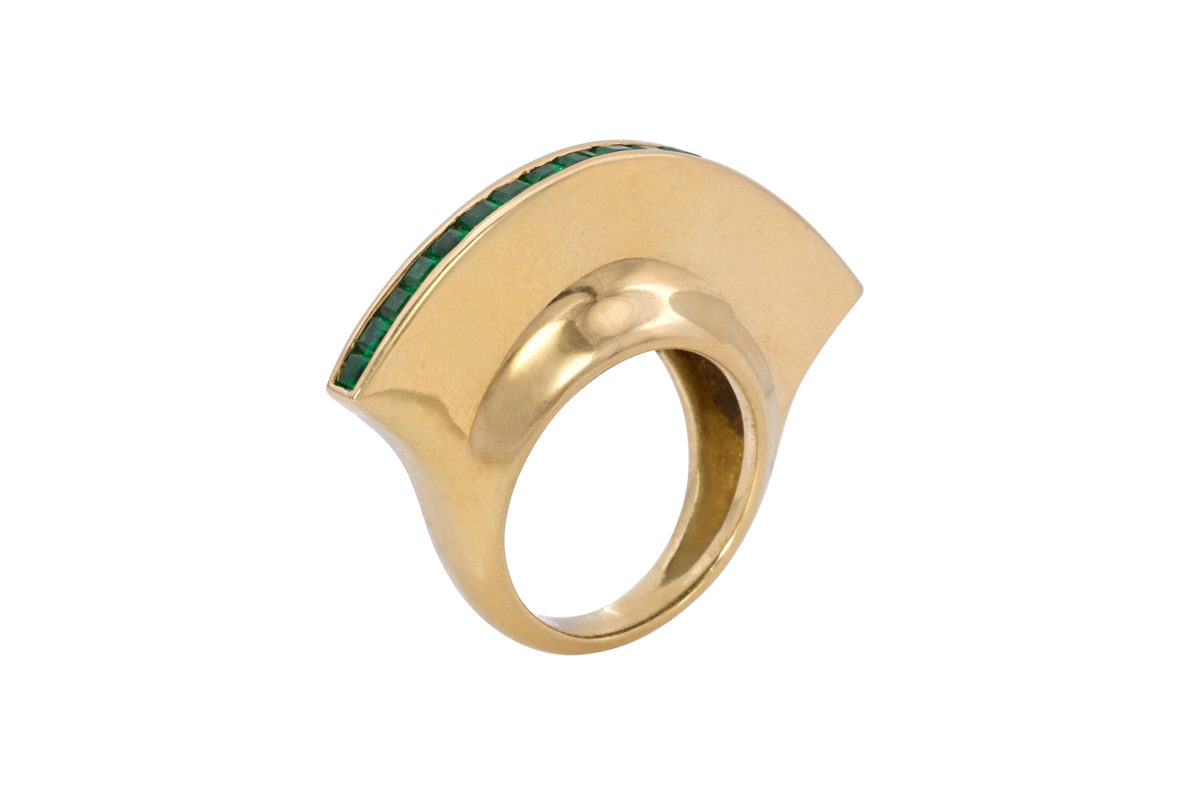 An emerald and 18 karat gold ring, by Paloma Picasso for Tiffany & Co., 1980, United States. 
Signed Paloma Picasso, Tiffany & Co., 1980. Stamped 18k. This ring has calibre cut channel-set emeralds. It is a size 6.25 and can be sized one size. 
One