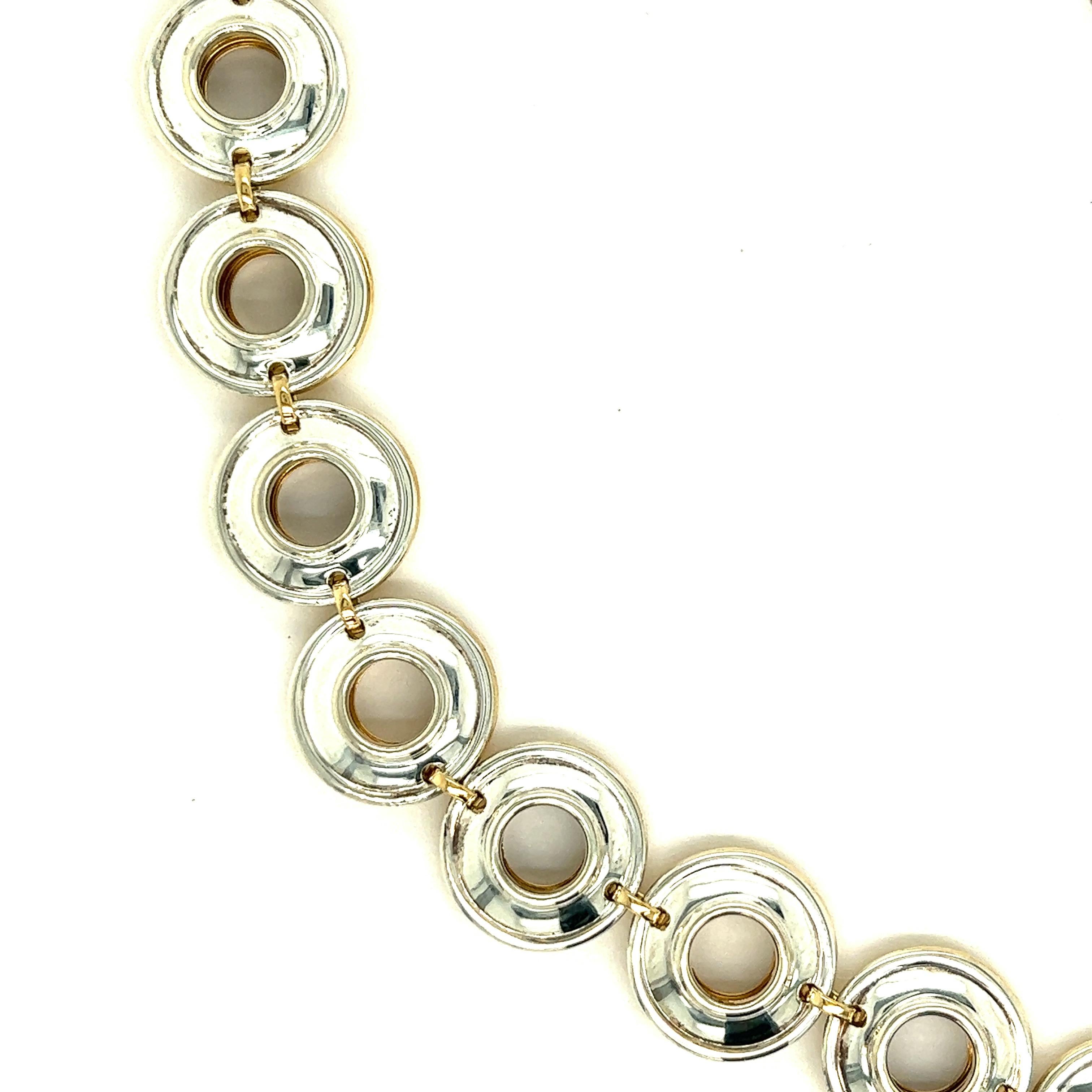 Paloma Picasso for Tiffany & Co. 18k Yellow Gold & Silver Link Necklace

Composed of concave circular links, one side is made of 18 karat yellow gold and the other is made of silver, featuring a toggle clasp; marked Paloma Picasso, Tiffany & Co.,