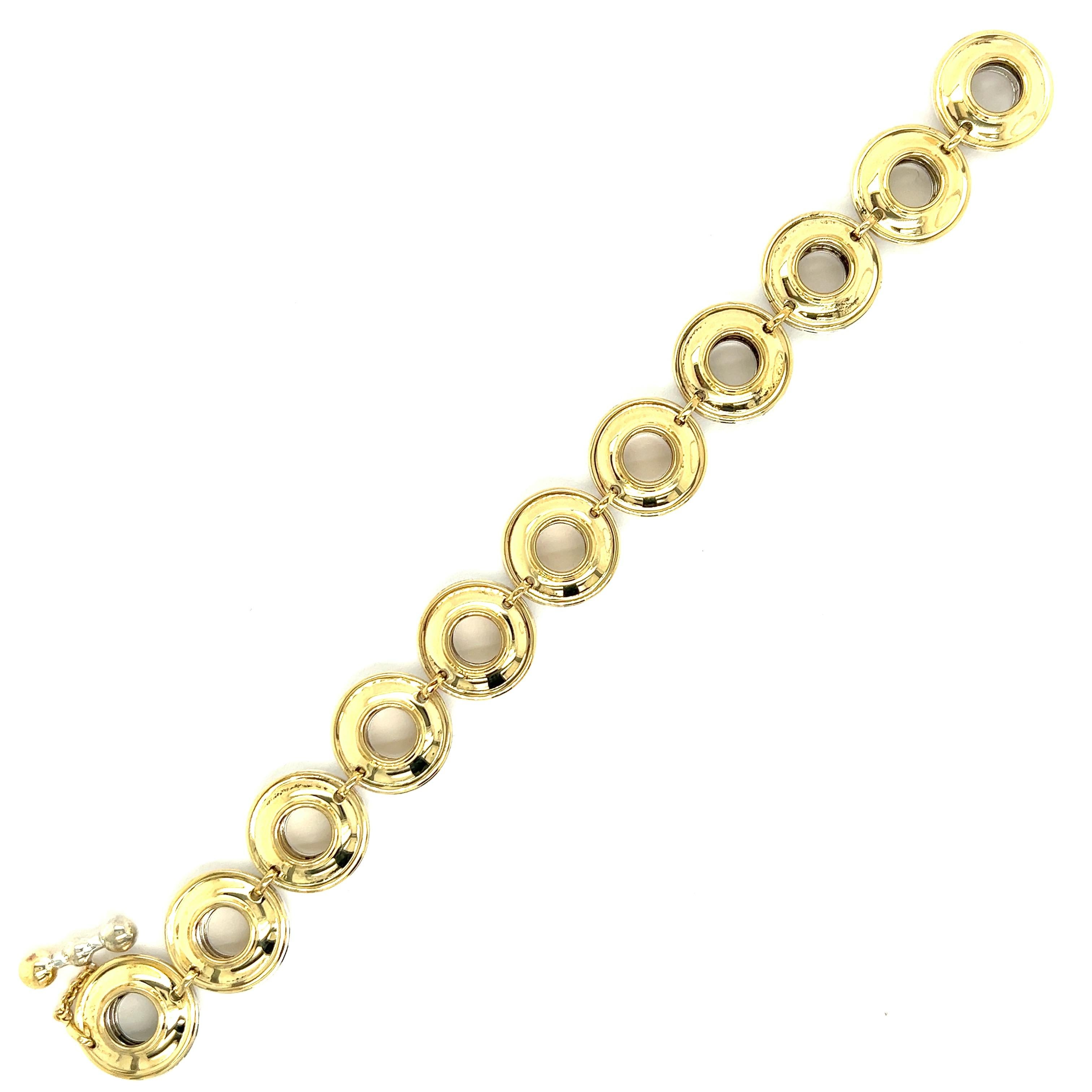 Paloma Picasso for Tiffany & Co. 18k Yellow Gold & Silver Links Bracelet

Composed of concave circular links, one side is made of 18 karat yellow gold and the other is made of silver, featuring a toggle clasp; marked Paloma Picasso, Tiffany & Co.,