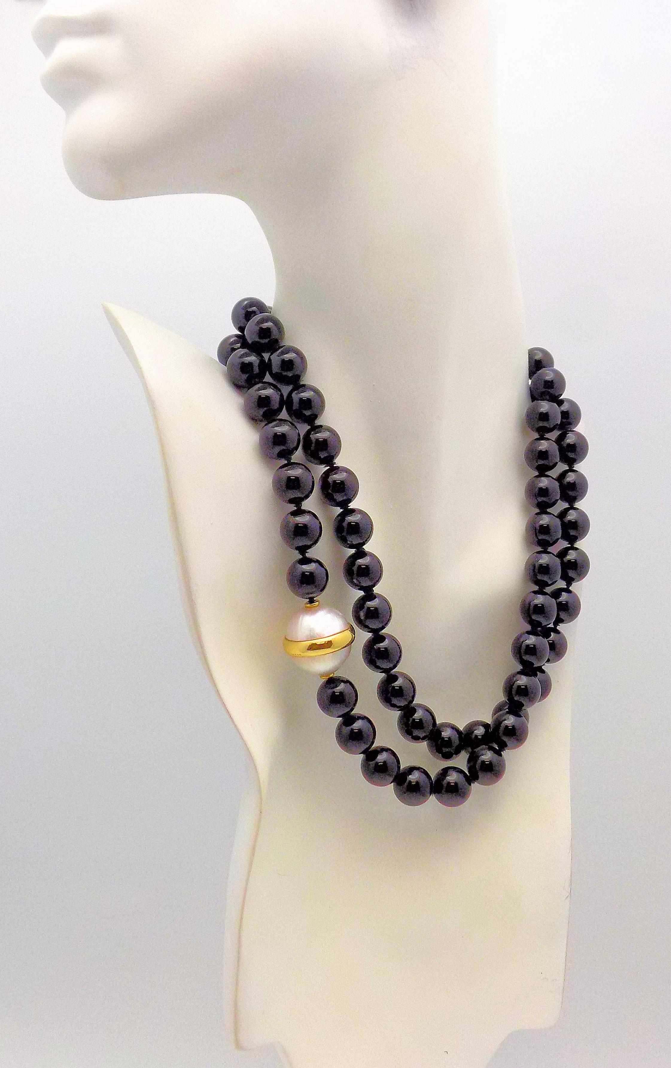 Classic 33 inch Black Onyx Bead Necklace, each bead measures 12mm, accented by 18 Karat Yellow Gold Trimmed Double Mabé Pearl measuring 18mm; Signed: Tiffany & Co Paloma Picasso 1981.