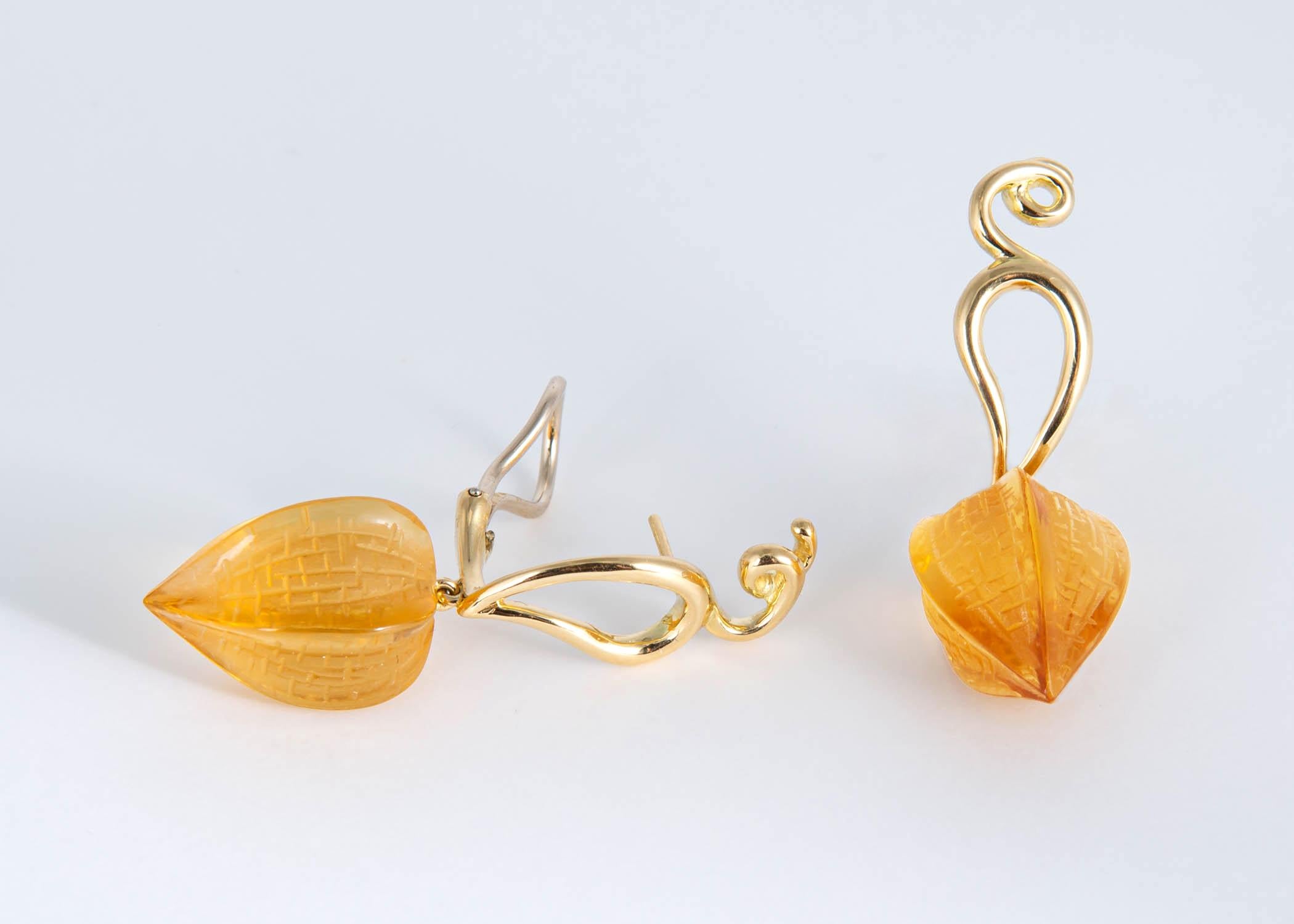 Paloma Picasso created a few designs featuring beautiful carved gemstones in the mid 1980's This earring has a matched pair of carved citrine floral pod shaped drops suspended from a vine motif earrings. 1 3/4's of an inch in length. Please ask me