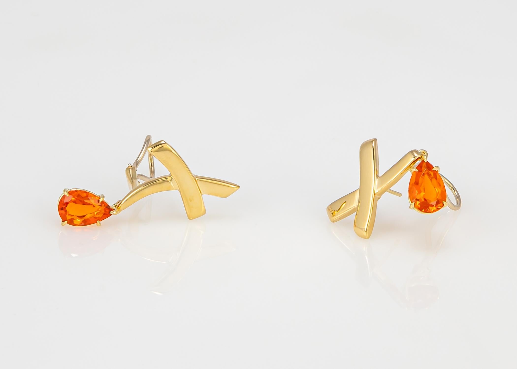 Paloma Picasso adds her unique imagination to the established quality of Tiffany jewelry. This Picasso classic features vivid fire opals that add a bright ray of sunshine.  The gold X portion is one inch in length and with the drops approximately 1