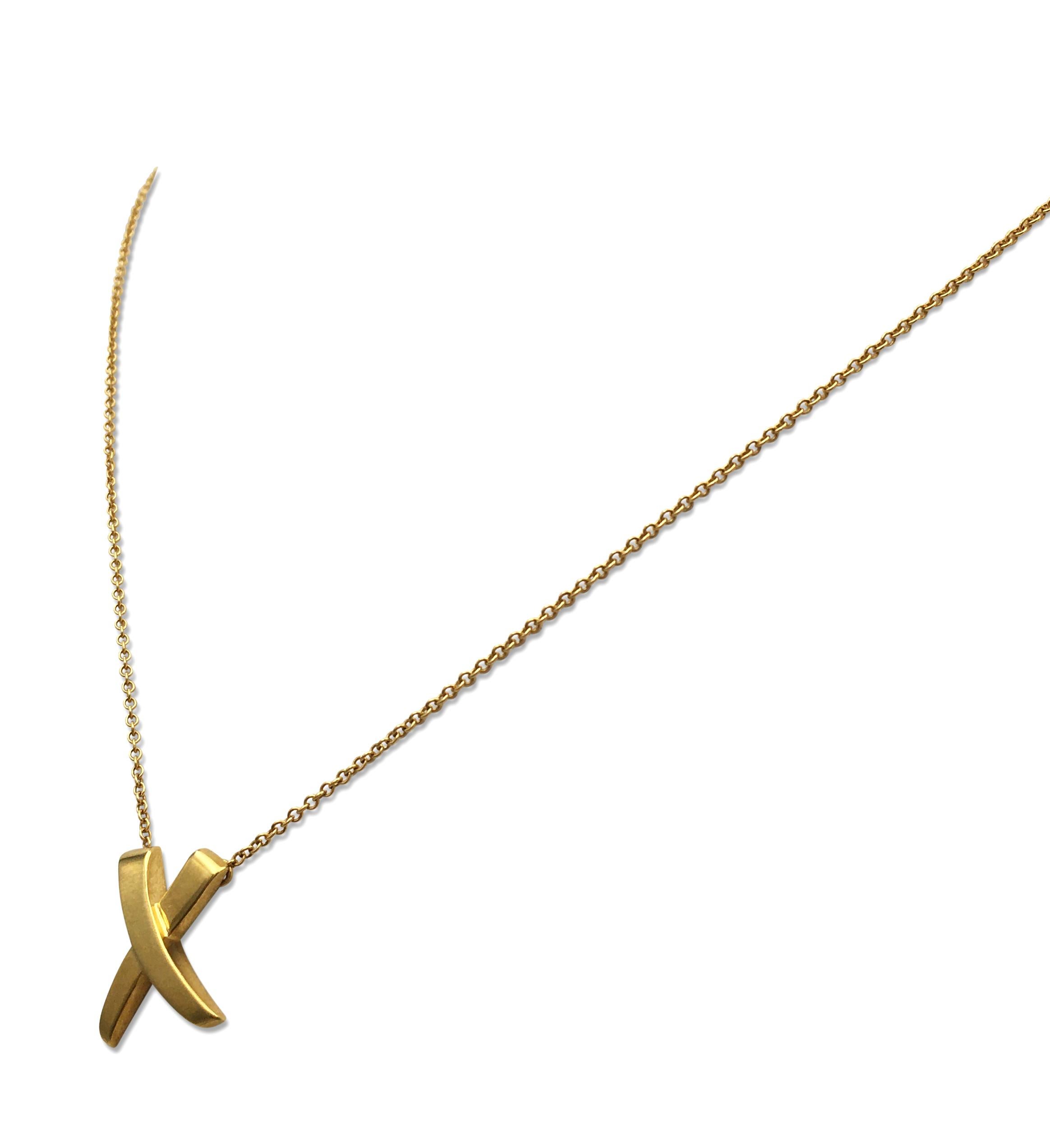 Authentic Paloma Picasso for Tiffany & Co. 'X' necklace crafted in 18 karat yellow gold. Signed Paloma Picasso, Tiffany & Co., 750. The pendant measures 11 x 12 mm, necklace measures 16 inches in length. The necklace is not presented with the