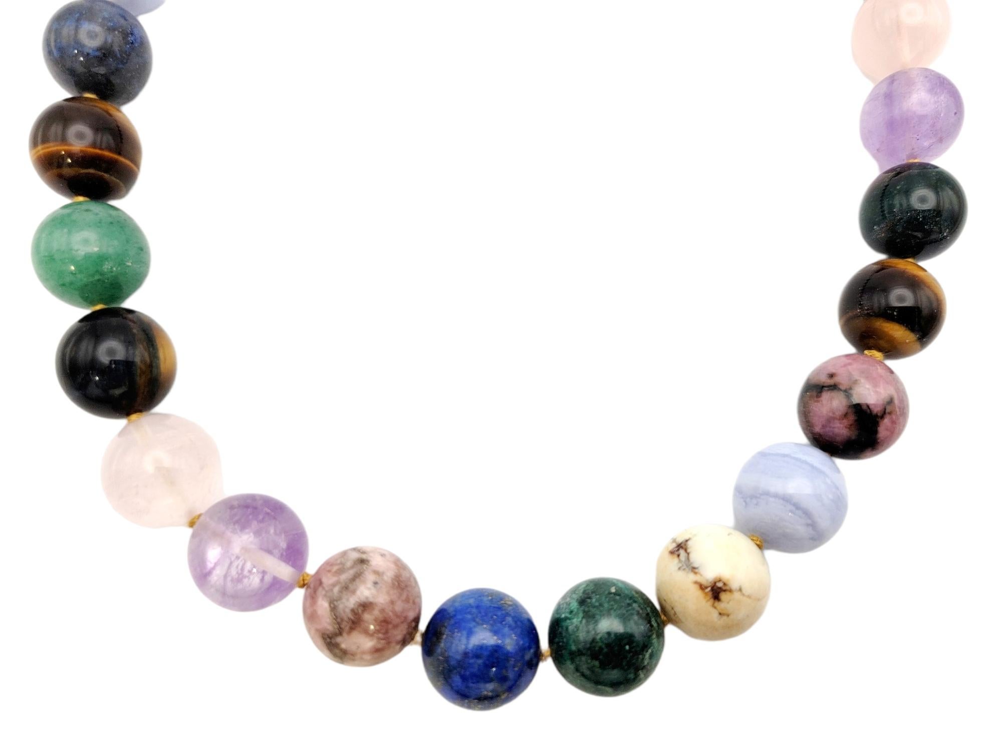Vibrant multi-gemstone beaded necklace bursting with color. This amazing rare Paloma Picasso piece from Tiffany & Co. absolutely lights up the neck! Featuring 27 assorted round polished gemstones in shades of pink, blue, purple, orange, brown and