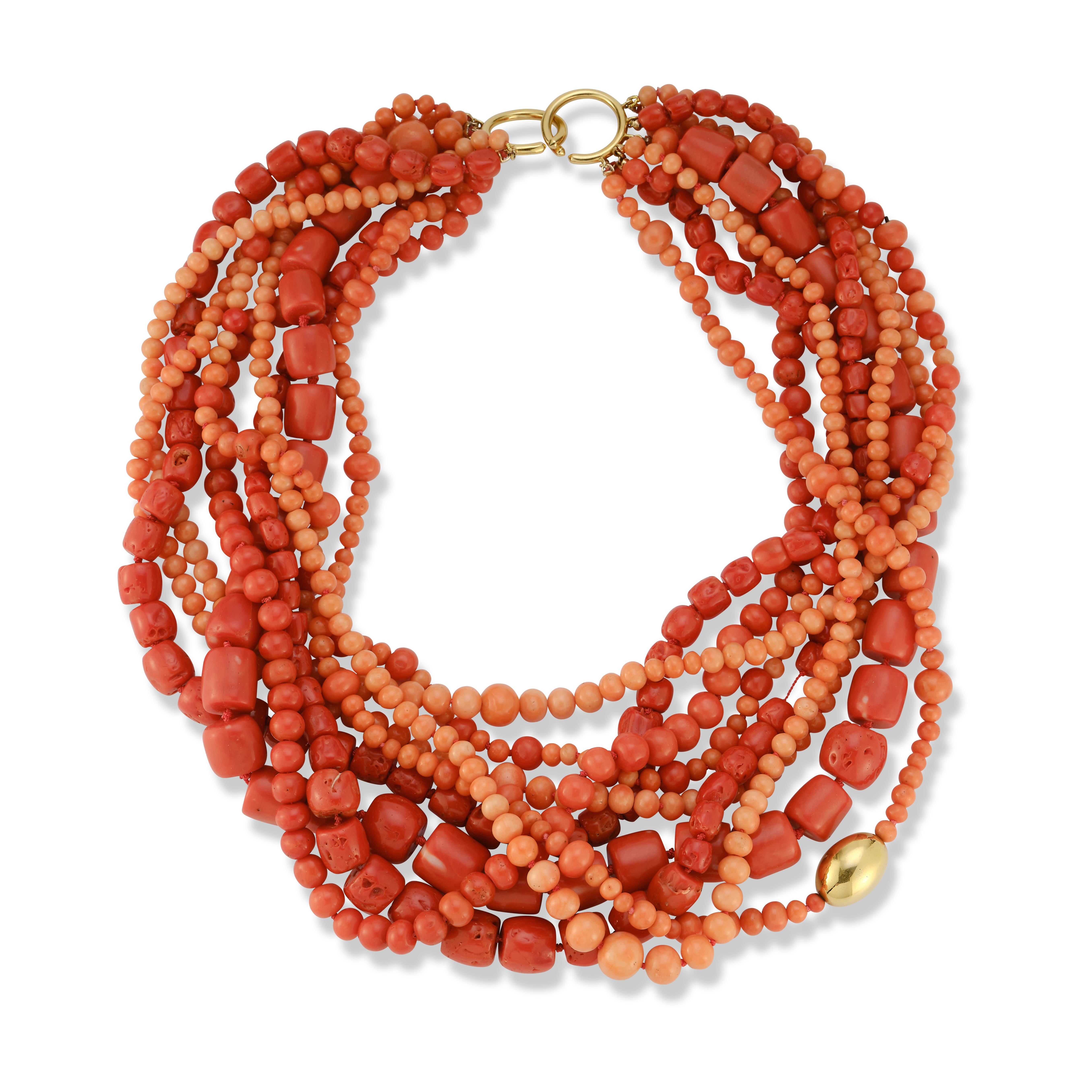 Paloma Picasso for Tiffany & Co. Multi Strand Coral Bead Necklace
 
9 strands of coral beads attached by an 18k gold clasp in a torsade design.

Signed: Paloma Picasso, Tiffany & Co.
Stamped: 1983, 18k

Length: 21