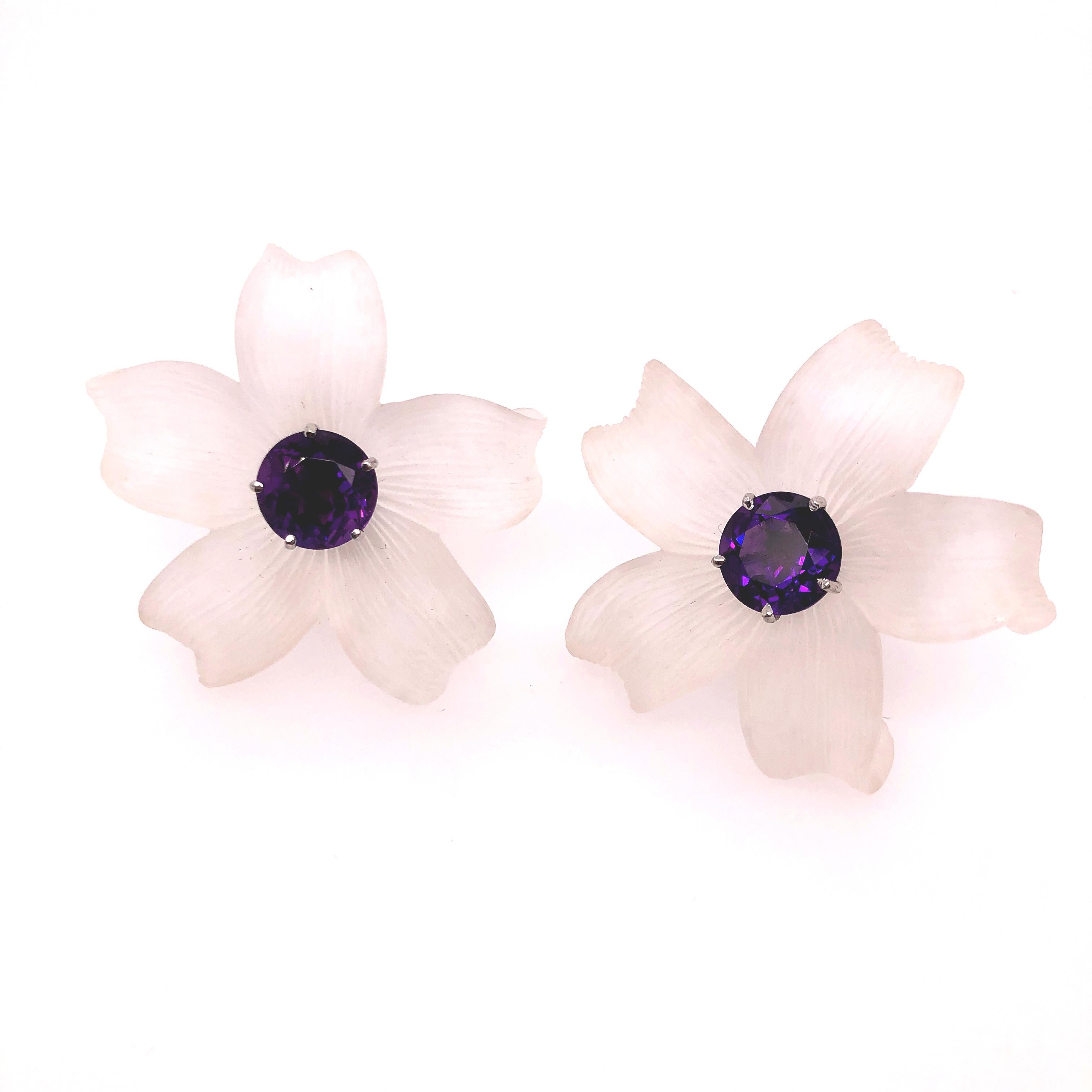 Paloma Picasso for Tiffany & Co. Quartz and Amethyst Flower Earrings. It is a beautiful and playful design. The quartz's translucent qualities plays with the light making the petals almost ghost like. In stark contrast the amethyst's vibrant deep